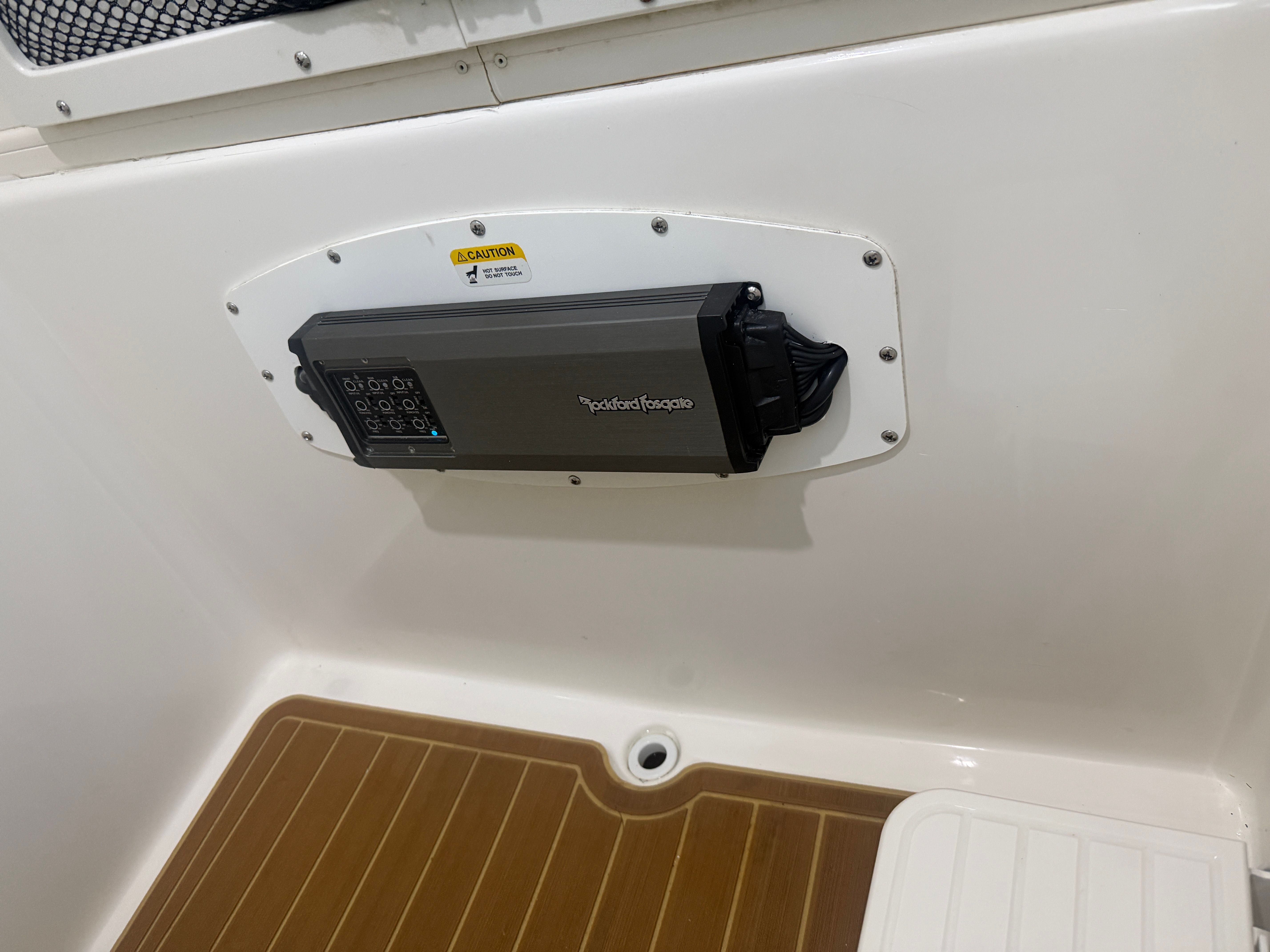 A Rockford Fosgate audio system is installed in the white wall of a 2019 NauticStar 28 XS.
