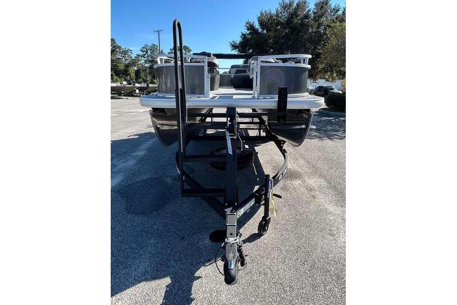 2026 Sun Tracker Bass Buggy 16 XL Select pontoon boat on trailer, parked outdoors.