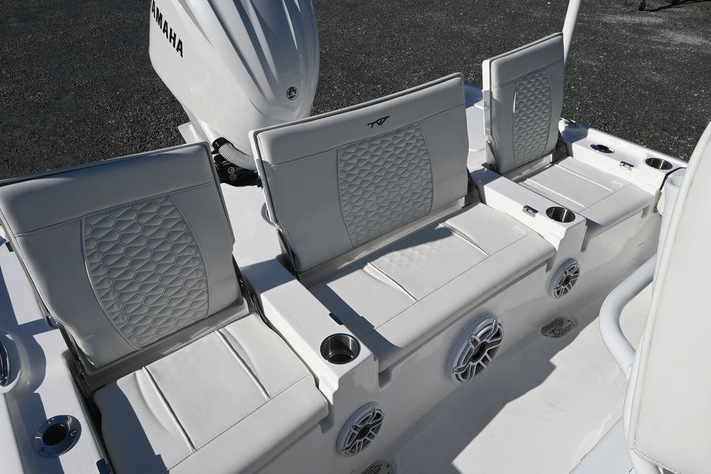 2026 Tidewater 2500 Carolina Bay boat seats with Yamaha engine, featuring cup holders and speakers.
