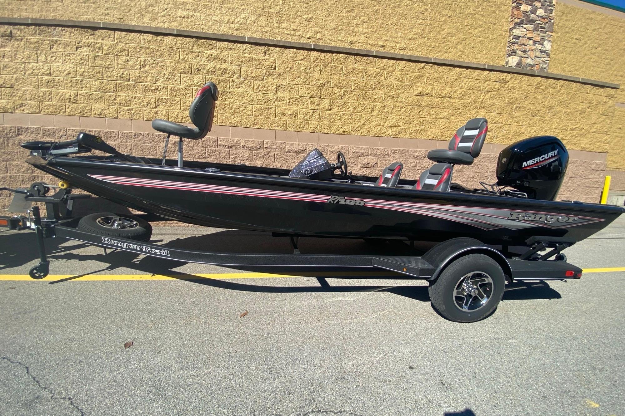 2026 Ranger RT188 fishing boat with Mercury engine on trailer, parked outdoors.