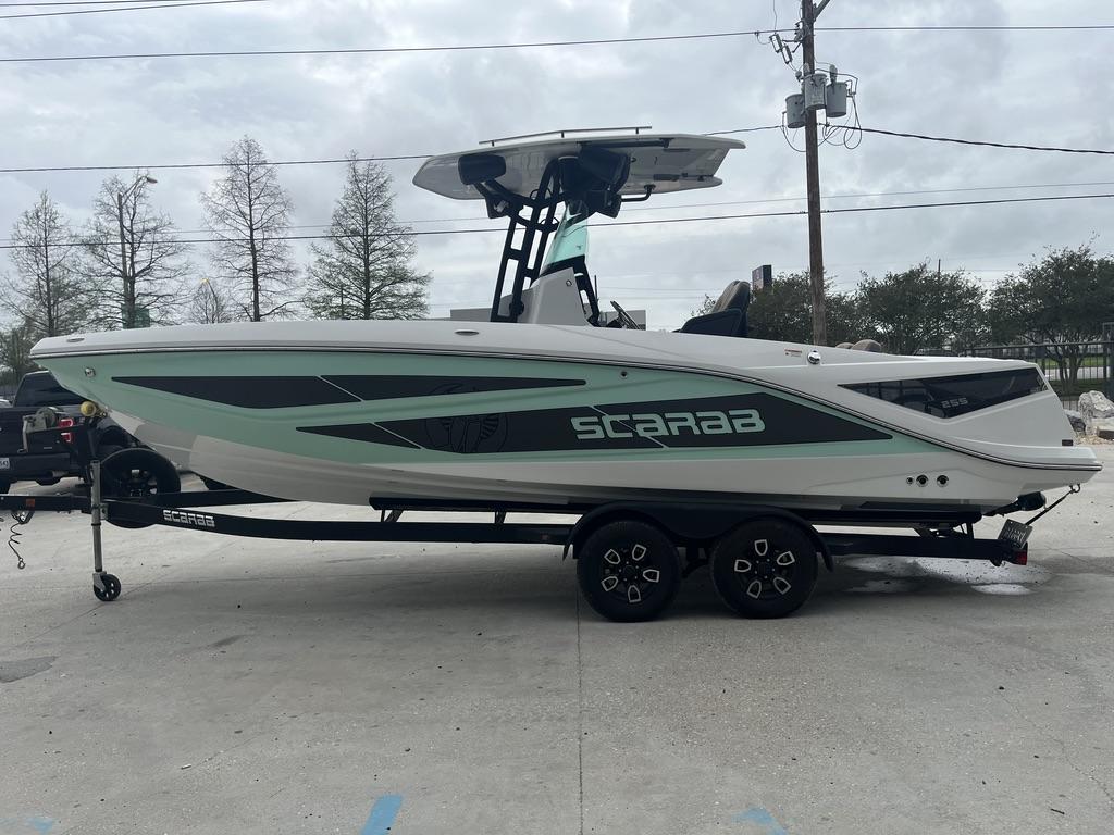 2022 Scarab 255 Open ID boat on trailer, side view, outdoors.