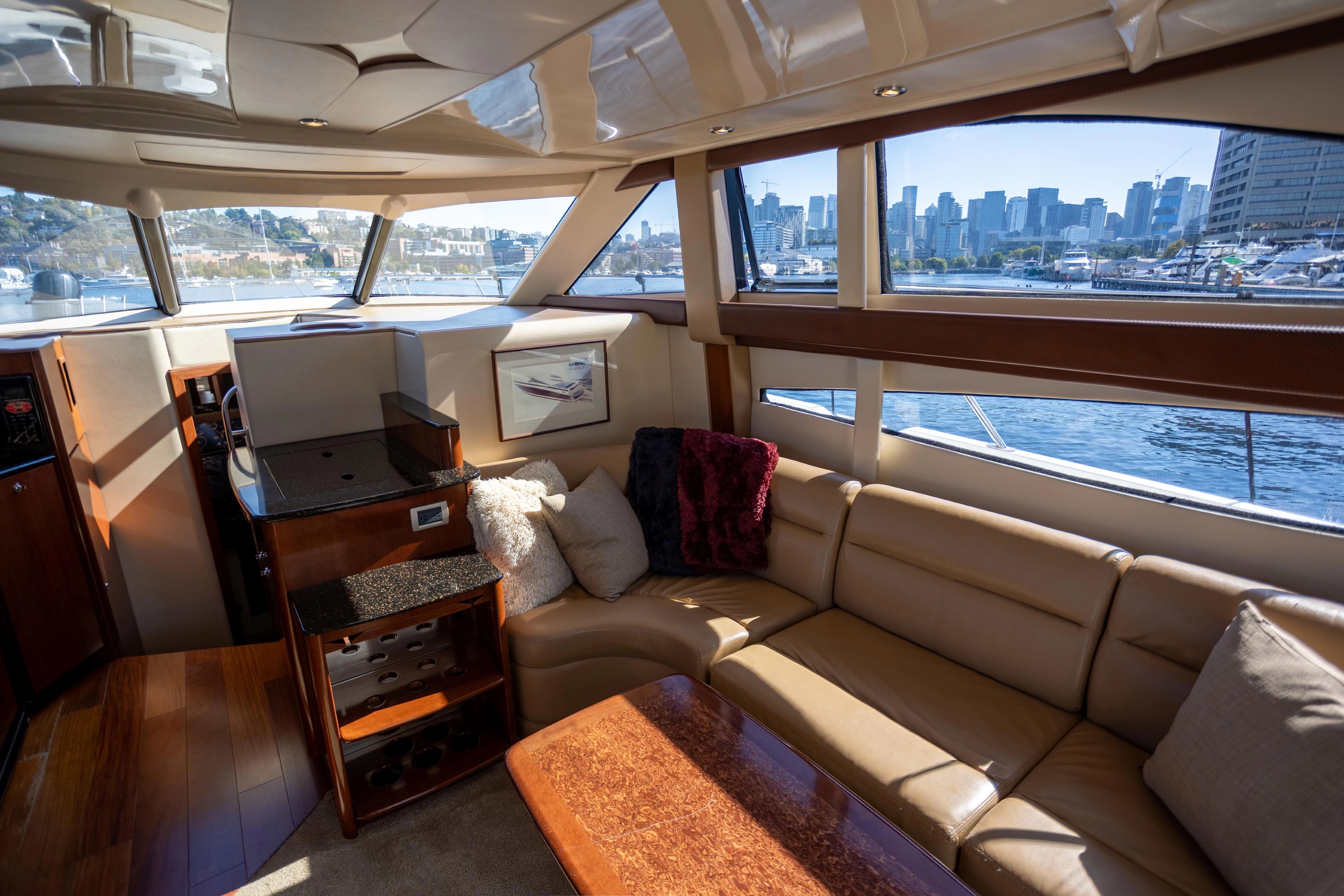 Interior of a 2008 Meridian 341 Sedan yacht with city view.