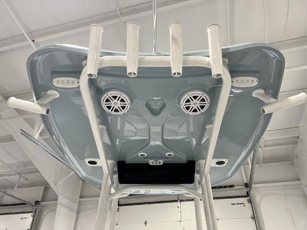 2025 Tidewater 2300 Carolina Bay boat T-top with rod holders and speakers.