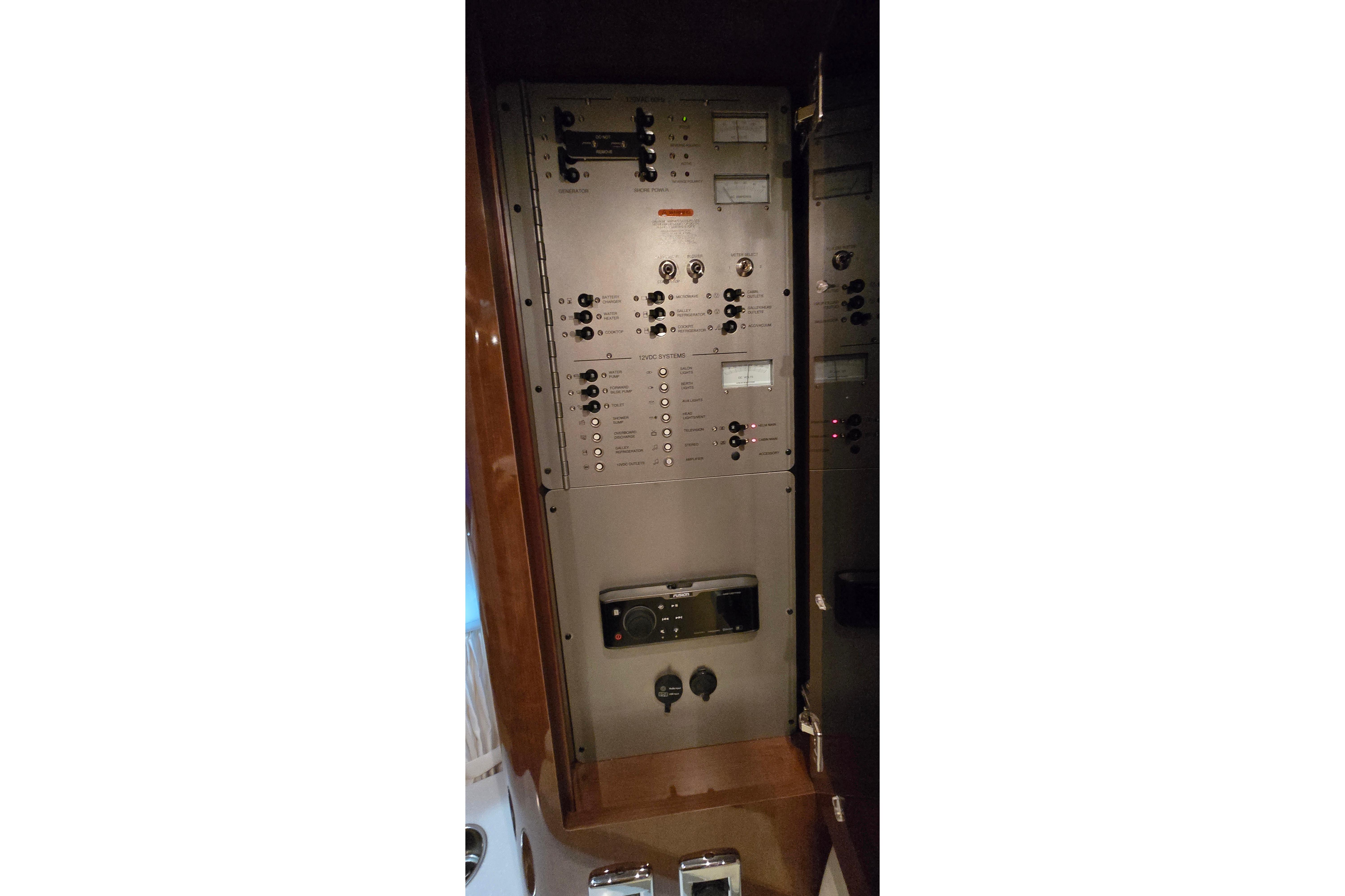 Electrical control panel inside 2018 Four Winns V355 boat, featuring switches and gauges.