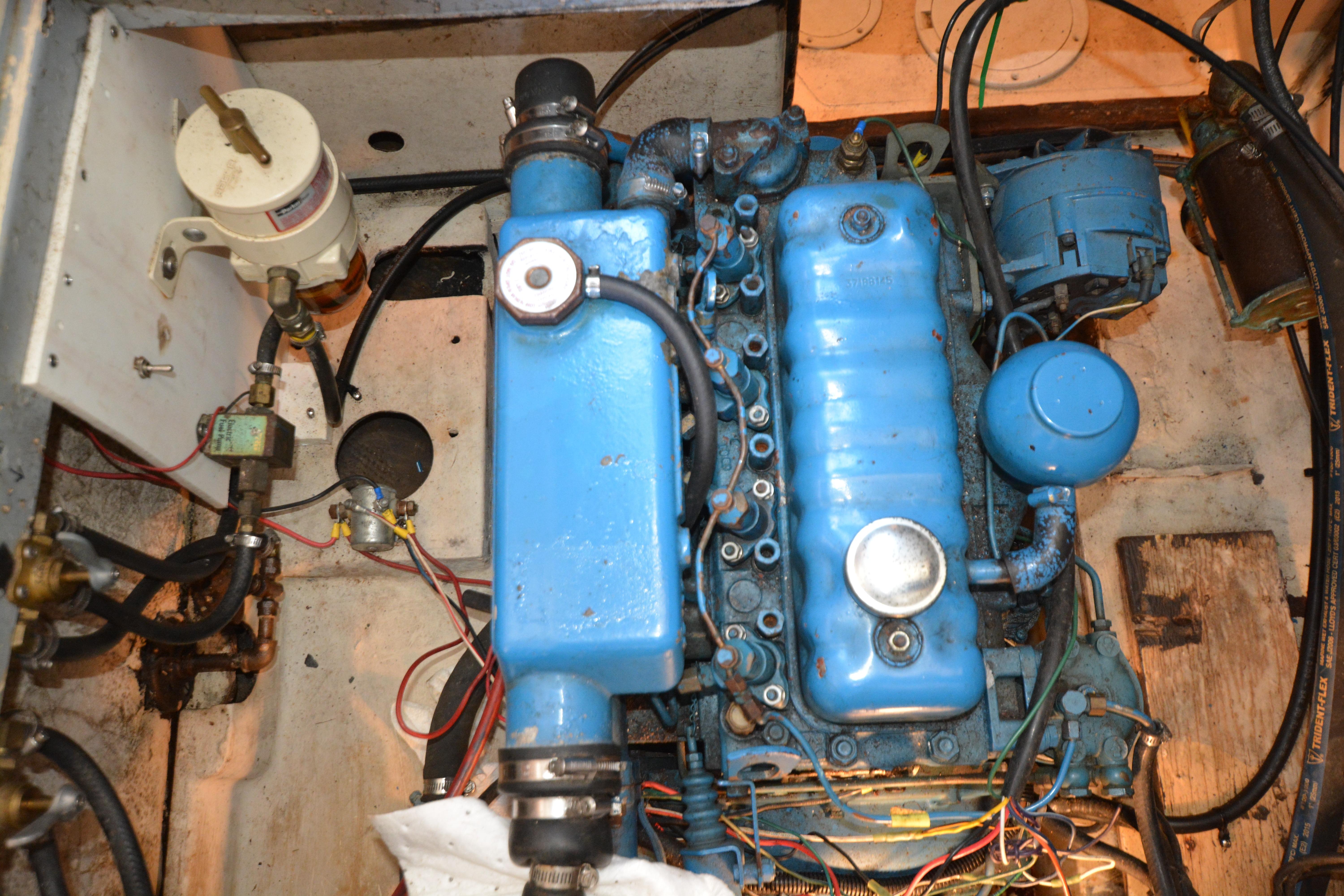 1974 Fales Navigator engine compartment with blue machinery and various components.