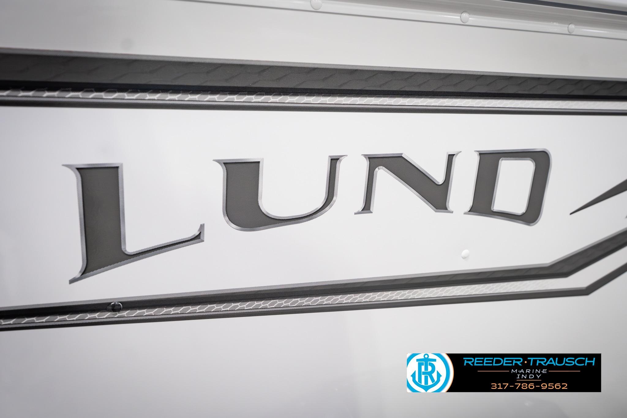 Close-up of 2026 Lund 1650 Rebel XL SS boat logo with dealership contact information.