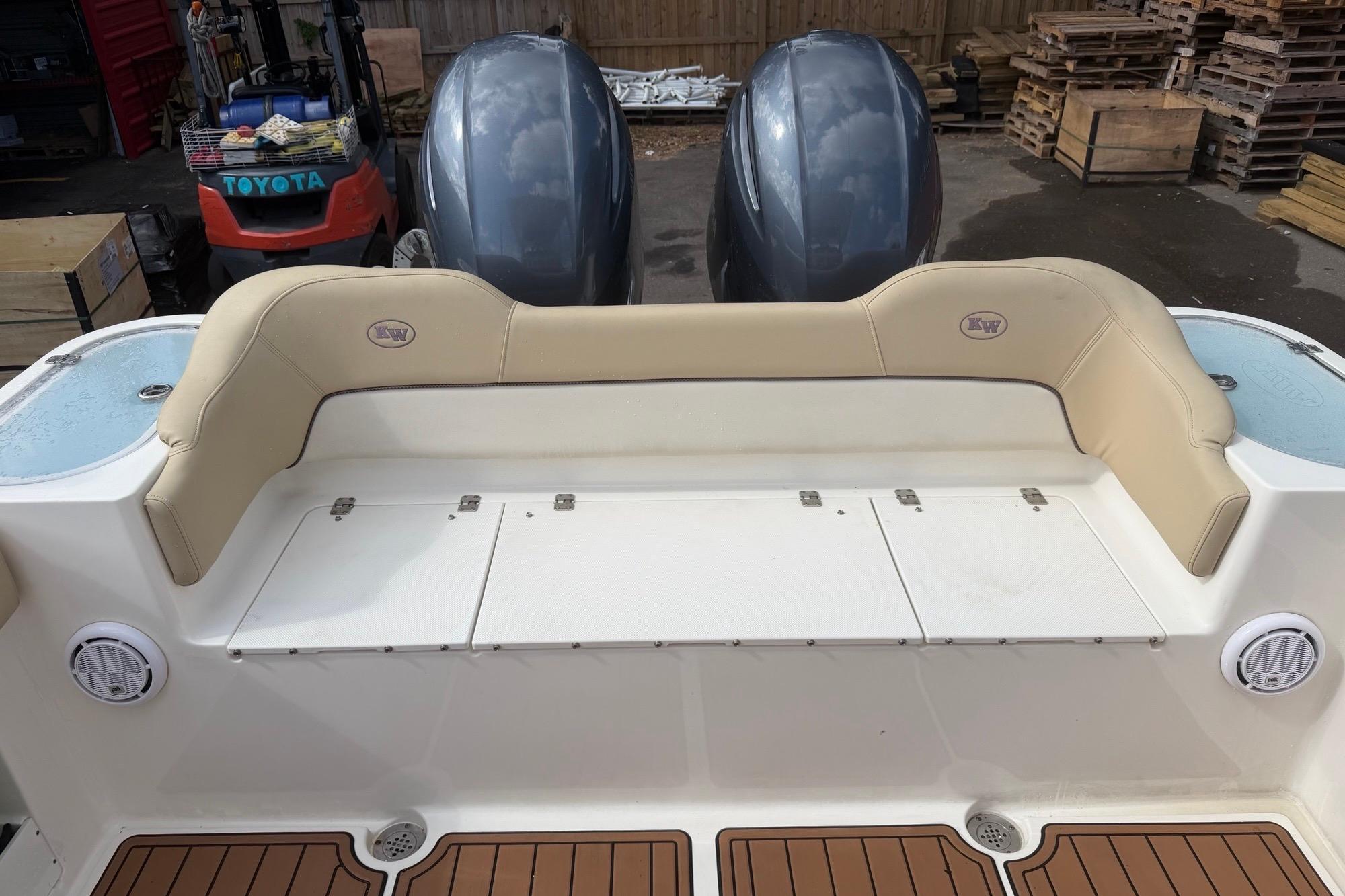 2019 Key West 263 FS boat interior with beige seating and twin engines.