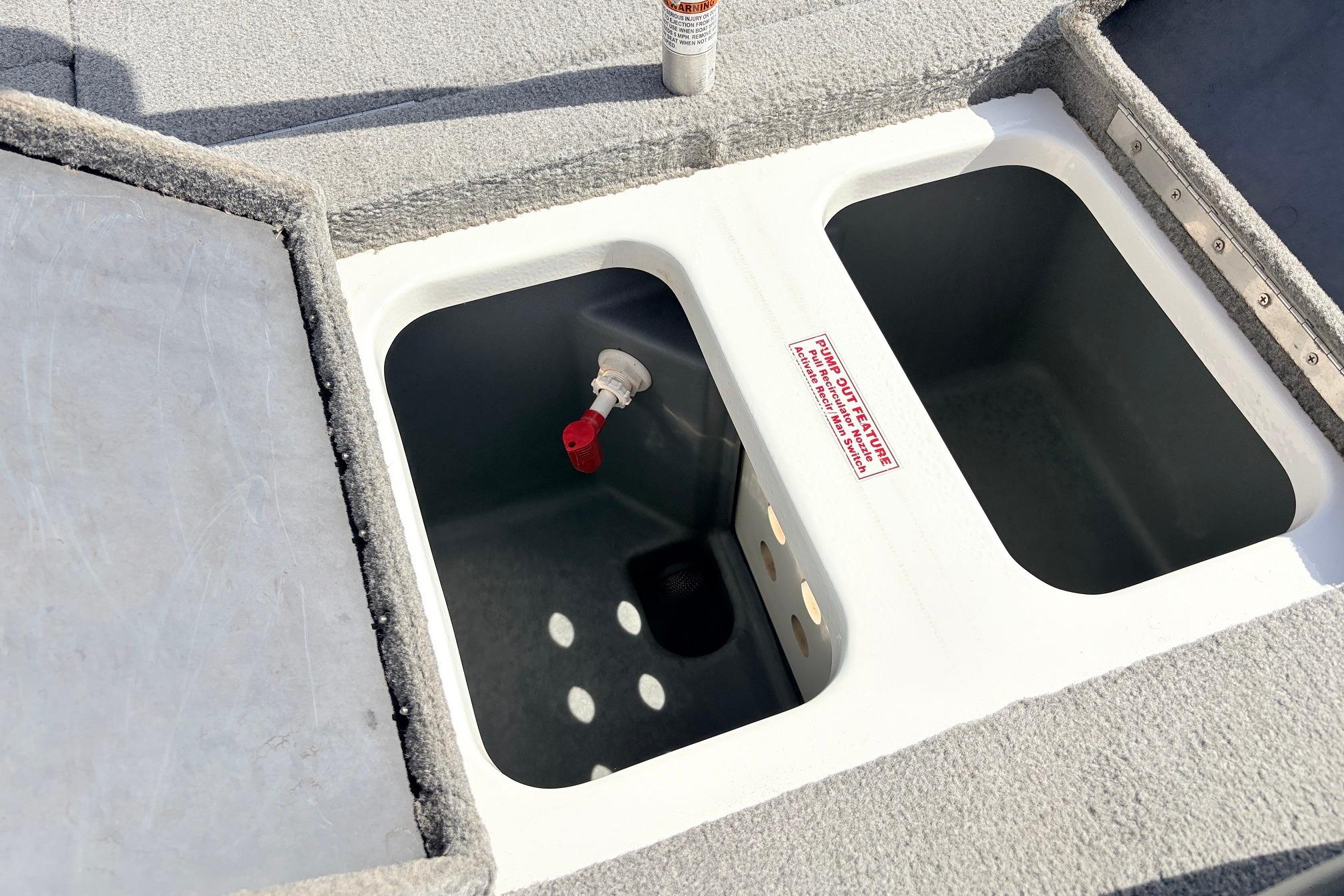 Livewell compartment on a 2011 Nitro Z-7 boat, featuring dual sections and a pump-out feature.