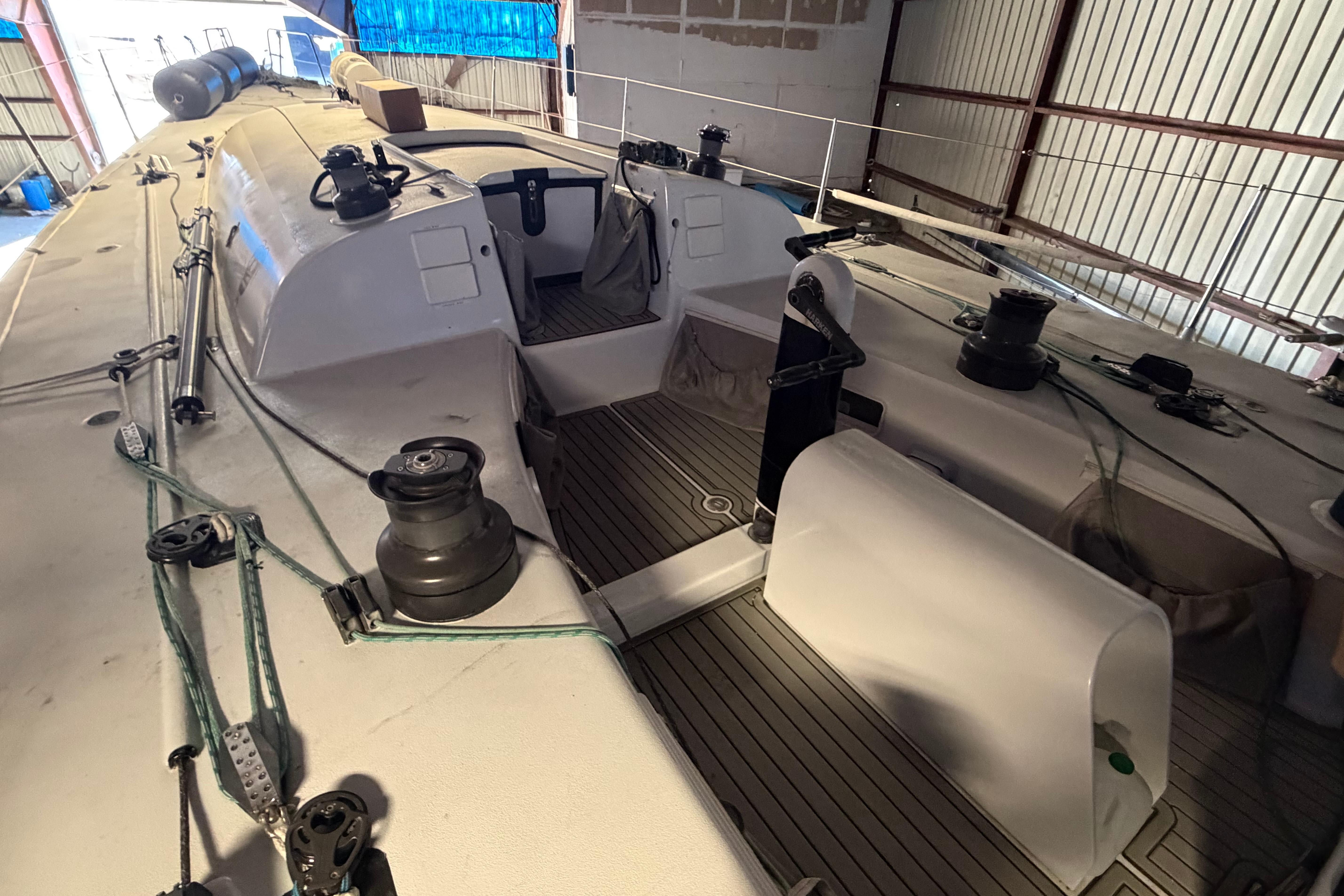 Andrews 63 sailboat deck in storage, featuring winches and rigging equipment.