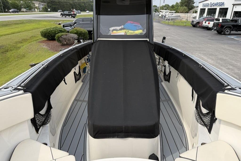 2023 Stingray 273 CC boat interior with black seating and storage nets.
