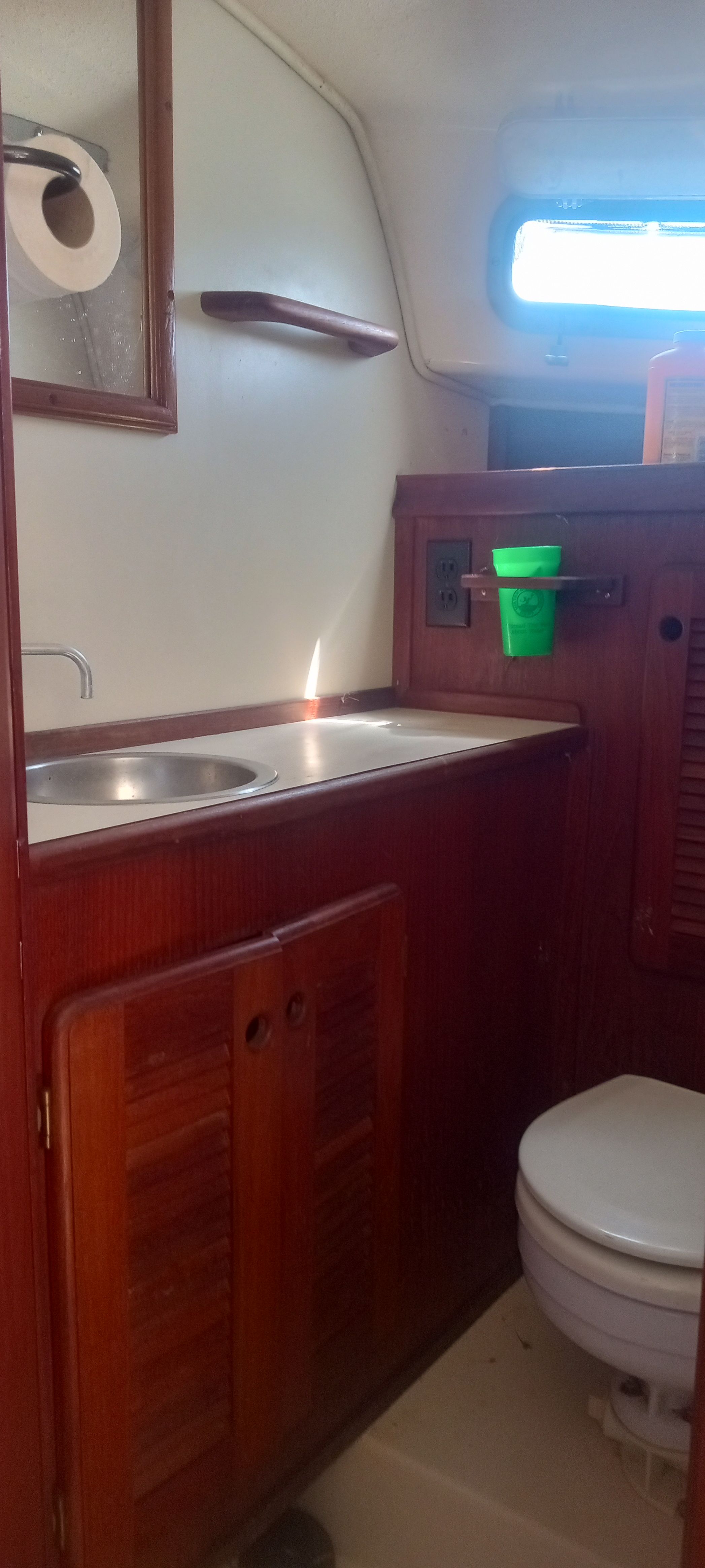 Interior of 1983 Island Packet MKII with sink and toilet.