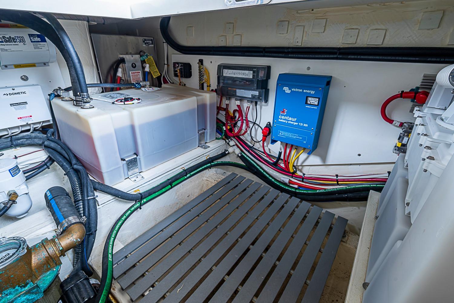 Engine room of 2023 Hinckley Sport Boat 40 X with electrical components and wiring.