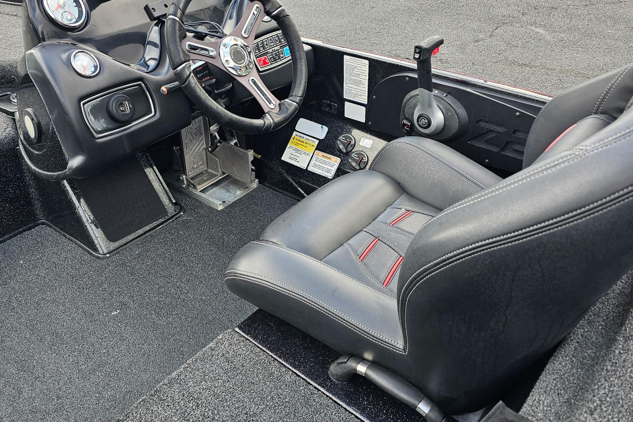 Interior of a 2017 Nitro Z20 Pro boat featuring steering wheel and control panel.
