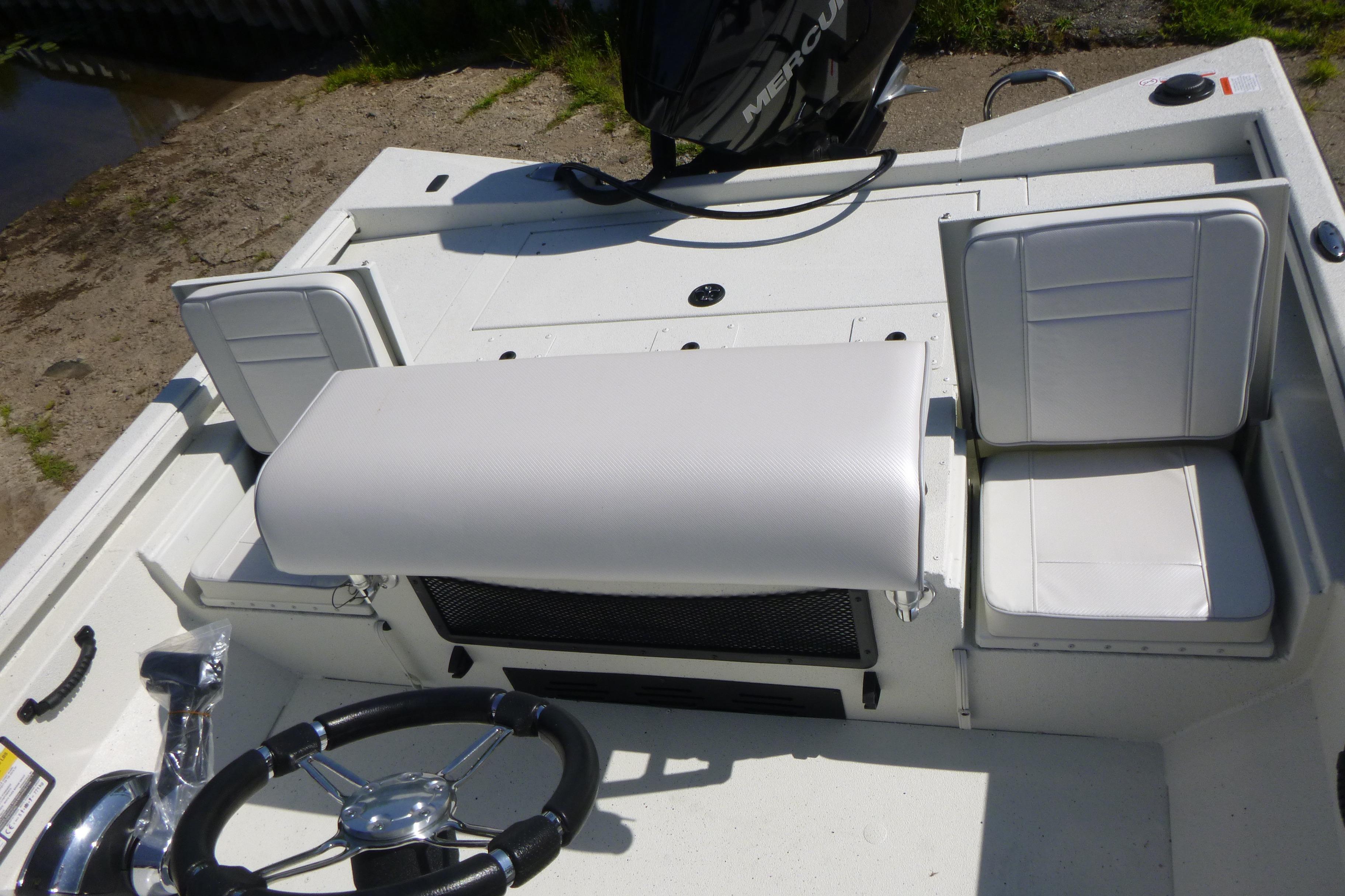 2025 Ranger RB210 boat interior with white seating and steering wheel.