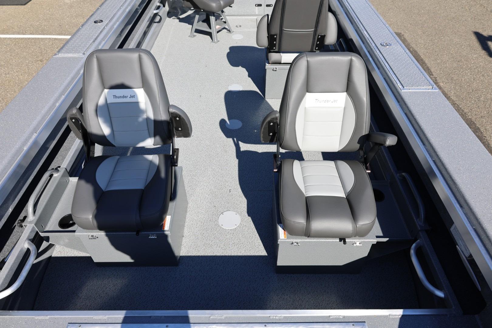 Interior of 2026 Thunder Jet 229 Rush OT boat with gray seating arrangement.