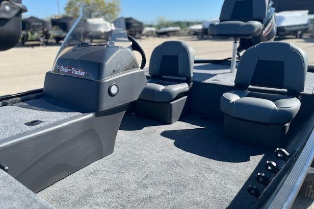 2026 Tracker Bass Tracker Classic XL boat interior with seating and console, in a sunny outdoor setting.