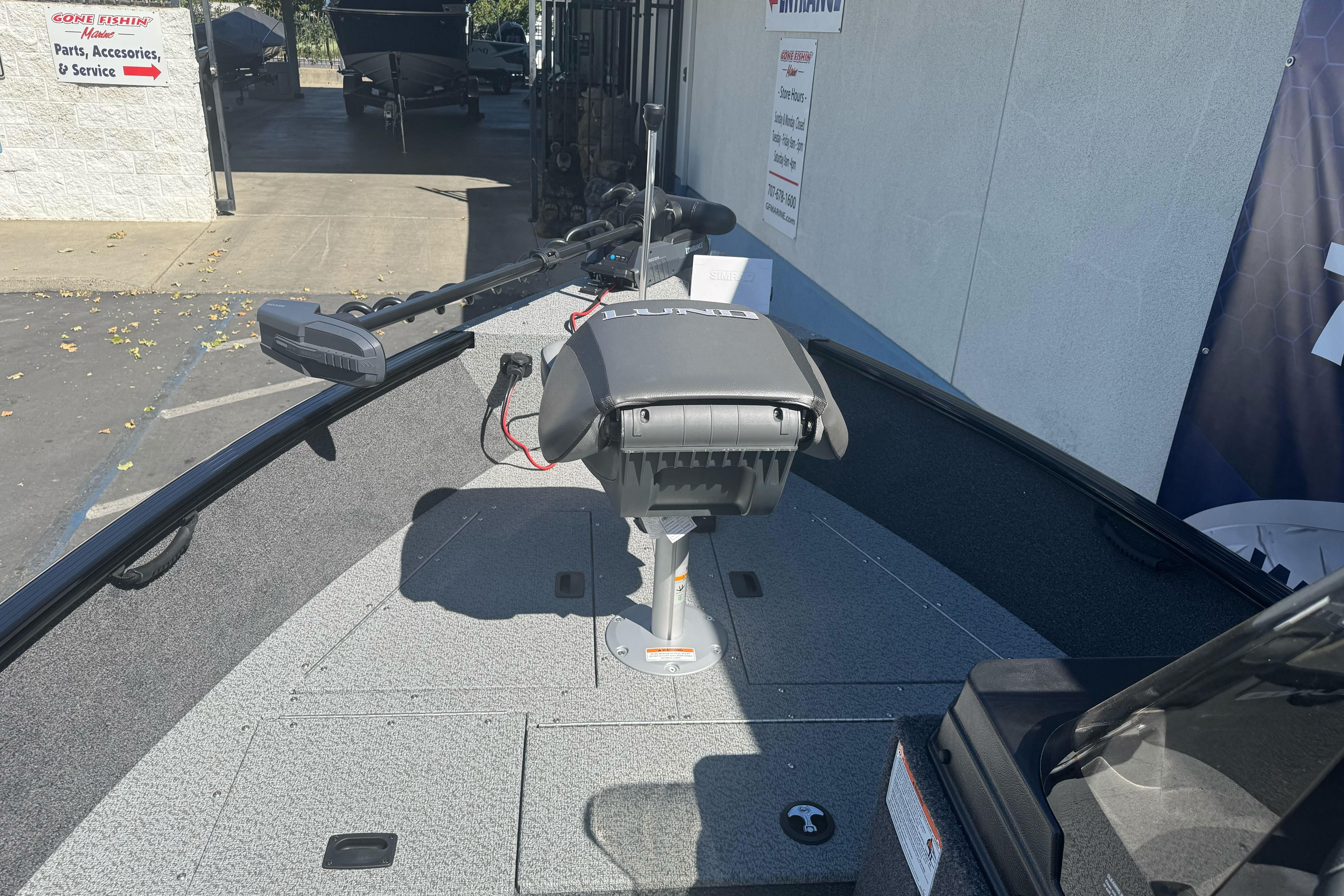 2026 Lund 1650 Rebel XL SS boat interior with trolling motor and seating.
