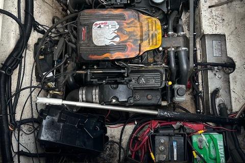 Engine compartment of a 2001 Rinker 270 FIESTA VEE boat, showcasing mechanical components.