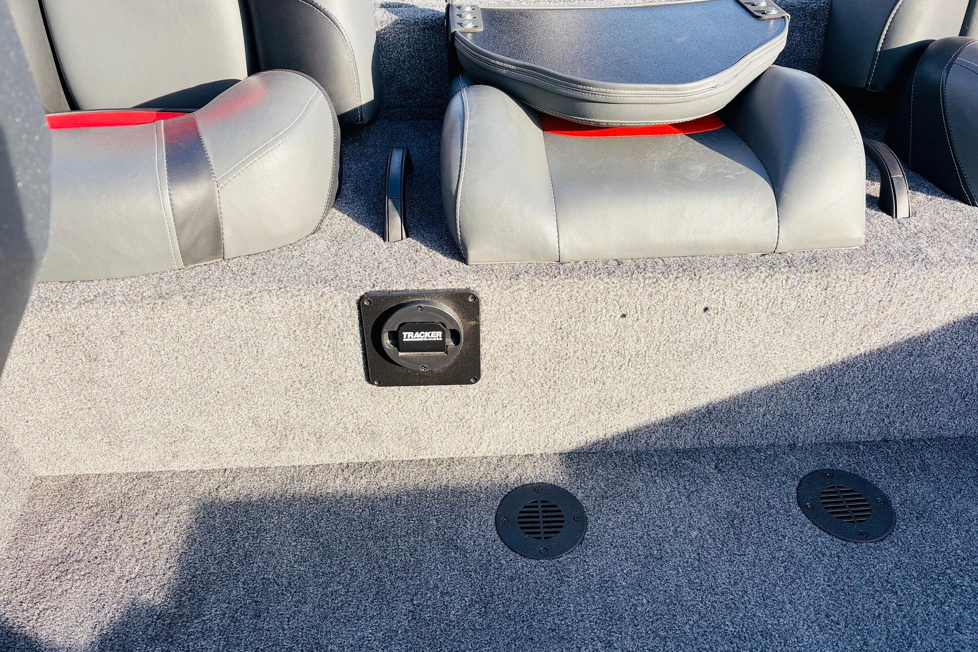 Interior of 2025 Tracker Savage 215 boat with gray seating and carpeted flooring.