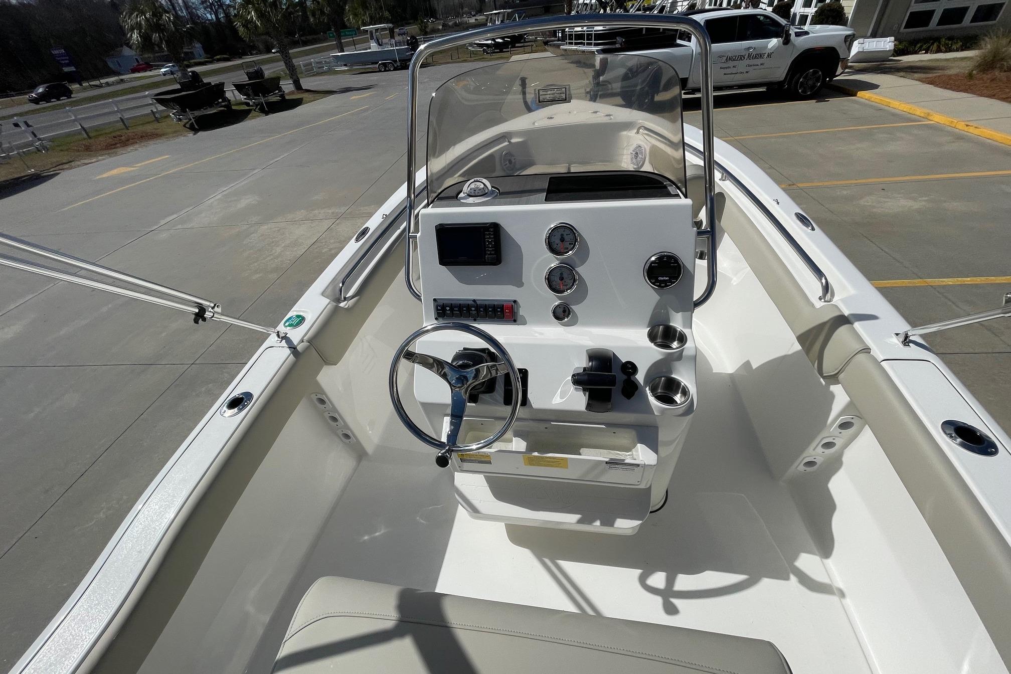 2026 Key West 203 FS boat interior with steering console and gauges.