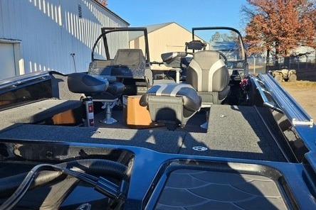 2026 Nitro ZV21 Pro boat interior with seating and storage, parked outdoors.