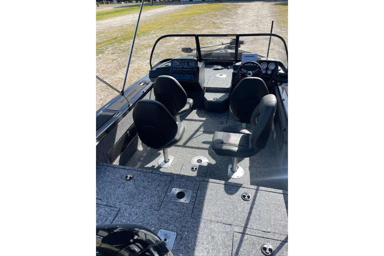 2026 Tracker Targa V-18 WT boat interior with four seats and steering console.