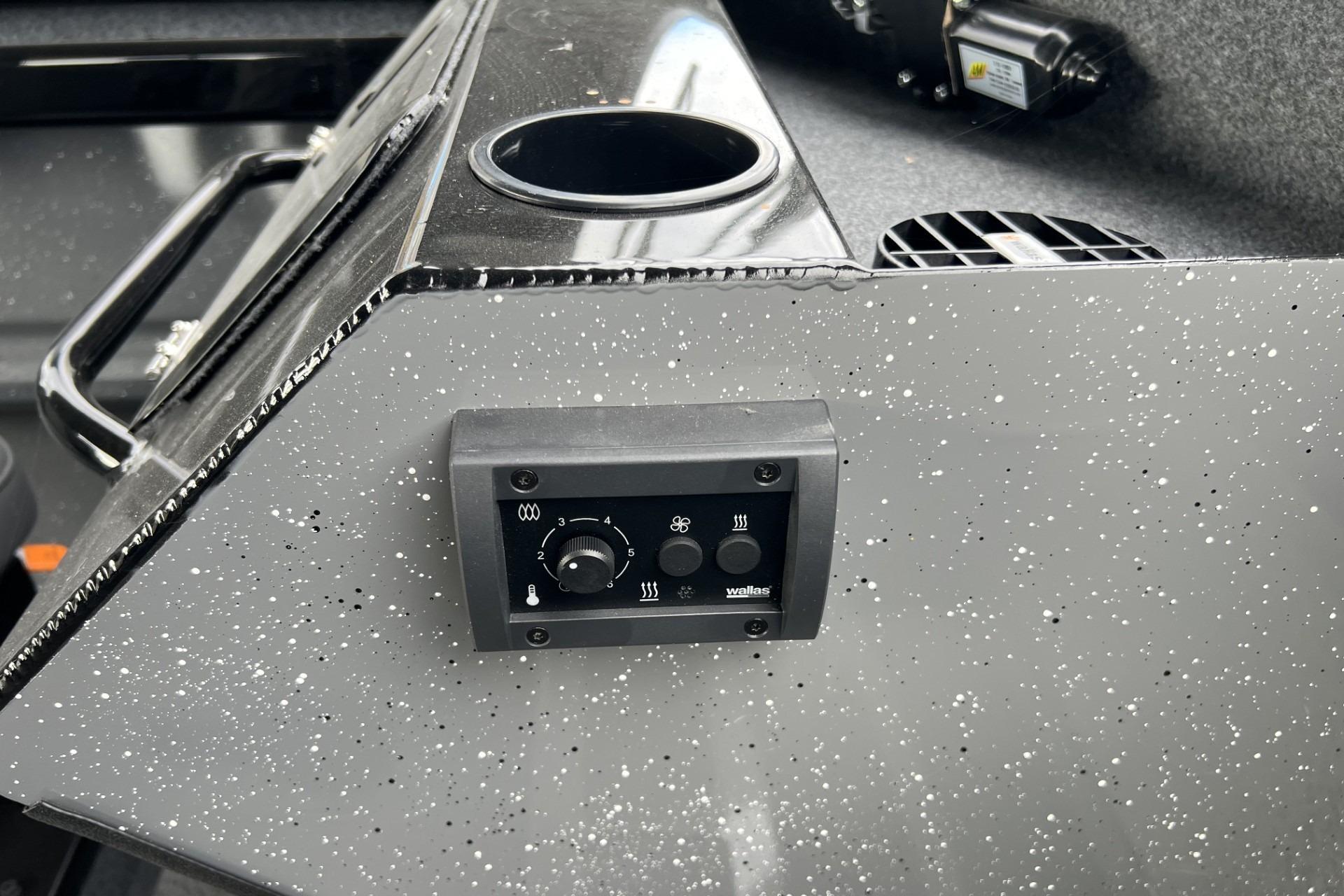 Control panel on 2024 Spartan 220 Maximus boat with speckled finish.