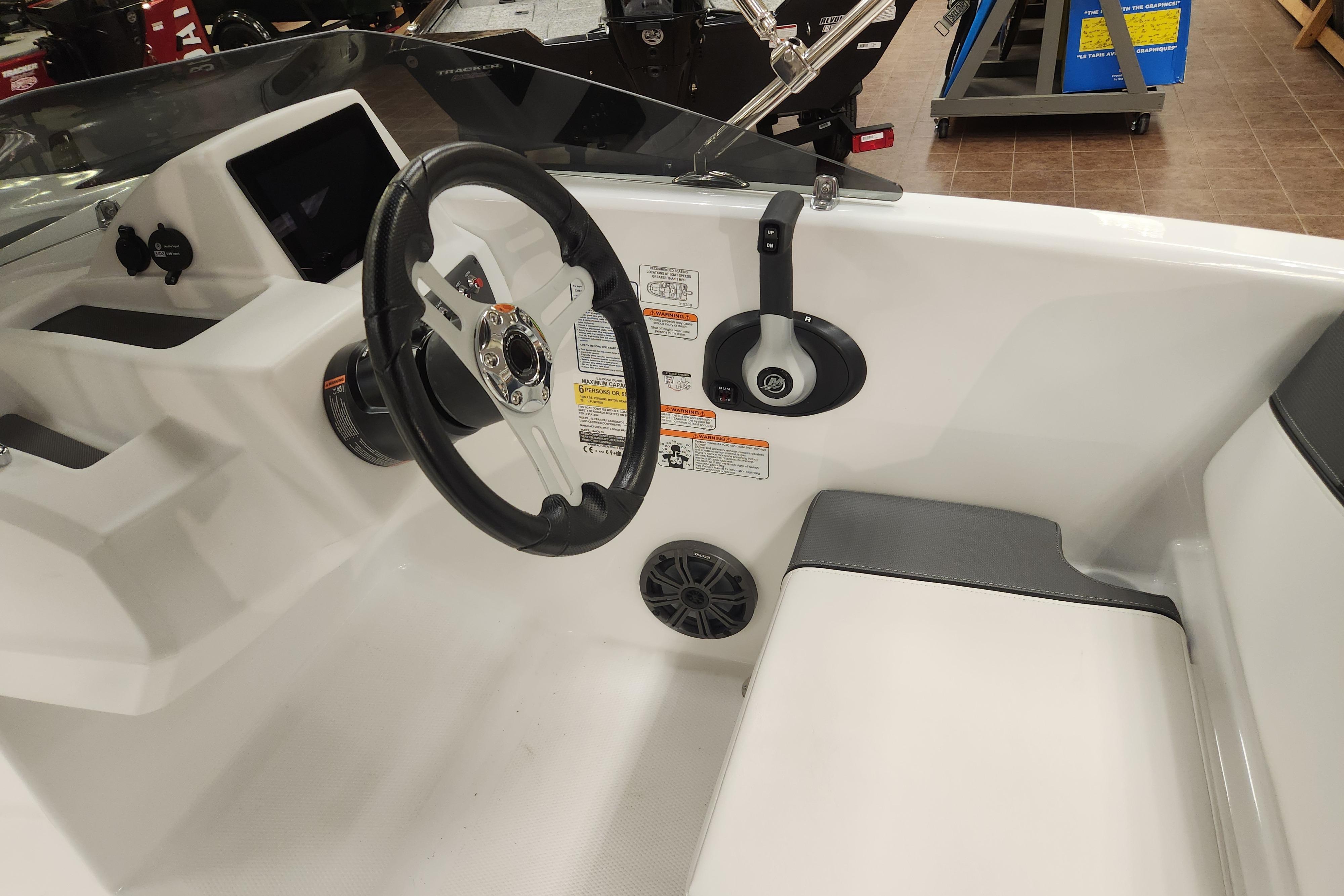 2026 Tahoe T16 boat interior with steering wheel and control panel.