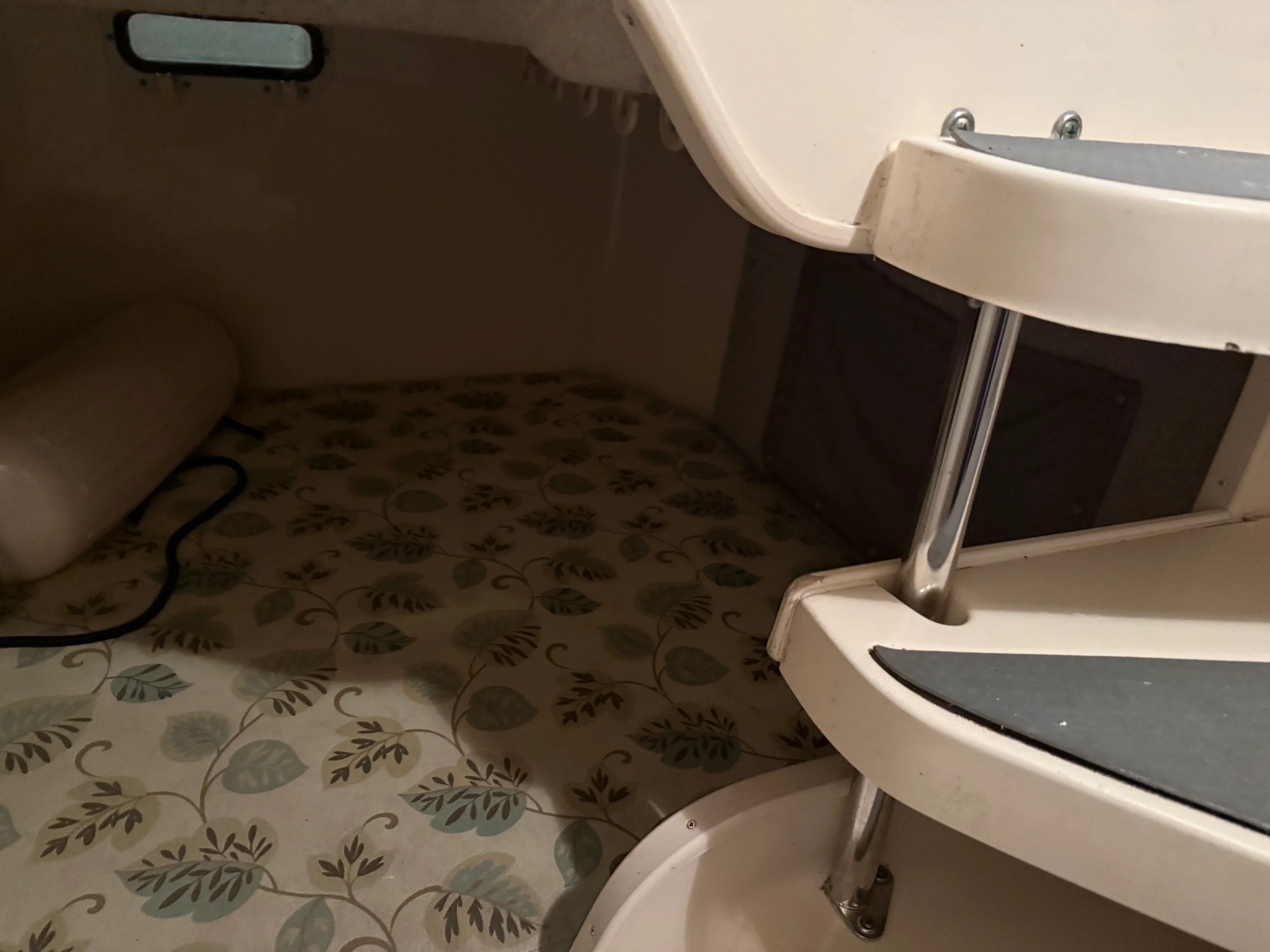 Interior of a 2002 Grady-White Marlin 300 with stairs.