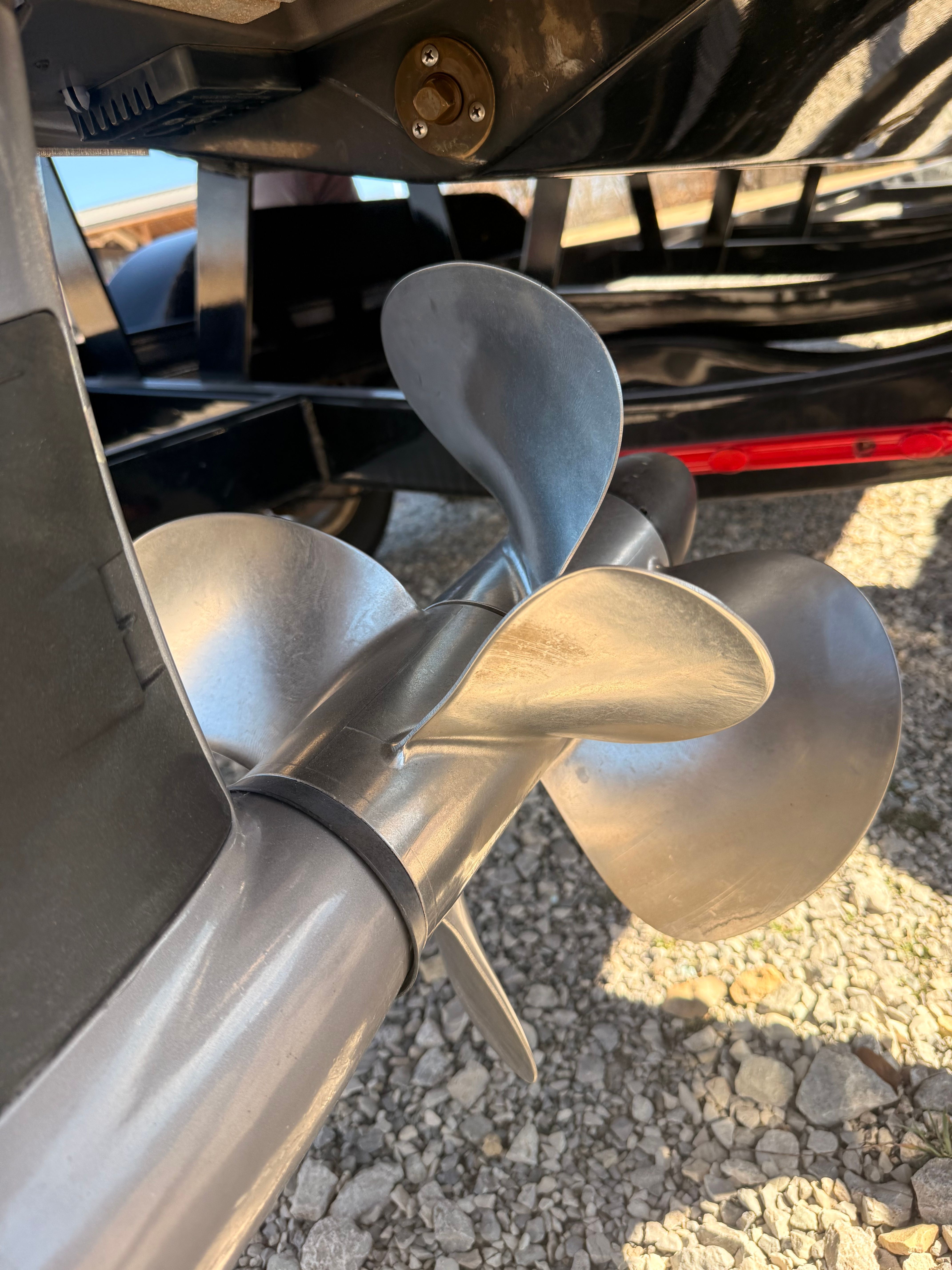 Close-up of a shiny propeller on a 2019 Cobalt R7 Surf boat.