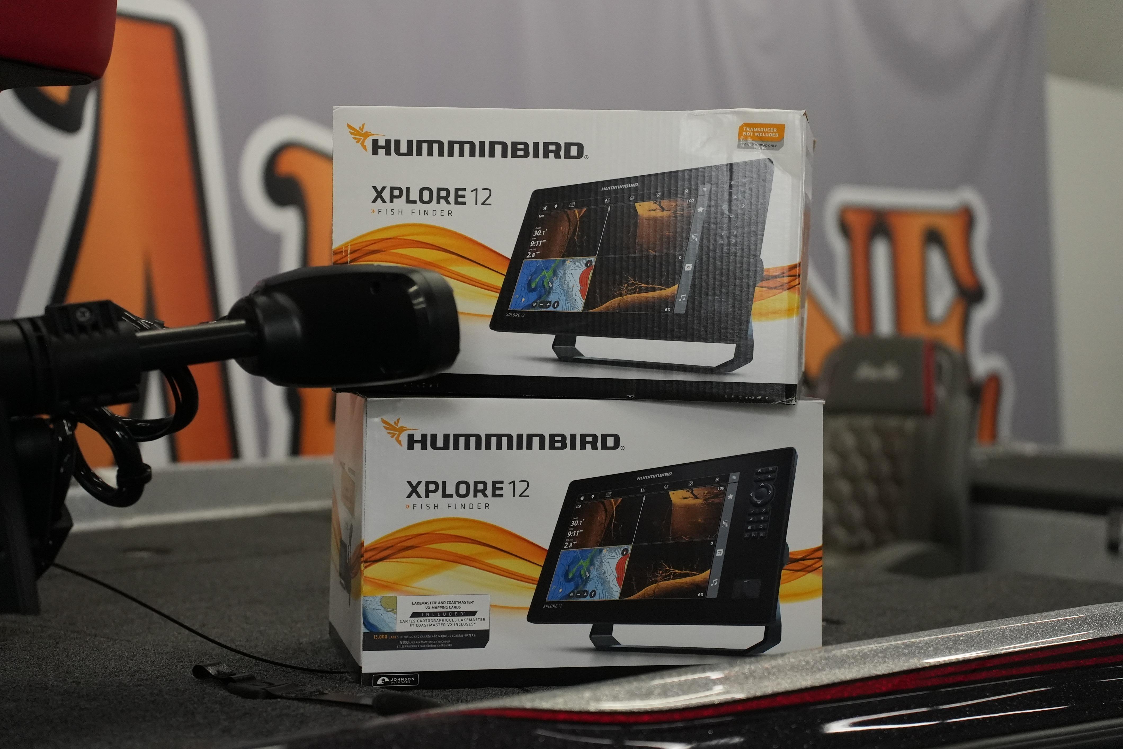Boxes of Humminbird XPLORE 12 fish finders on a 2026 Bass Cat Lynx STS boat.