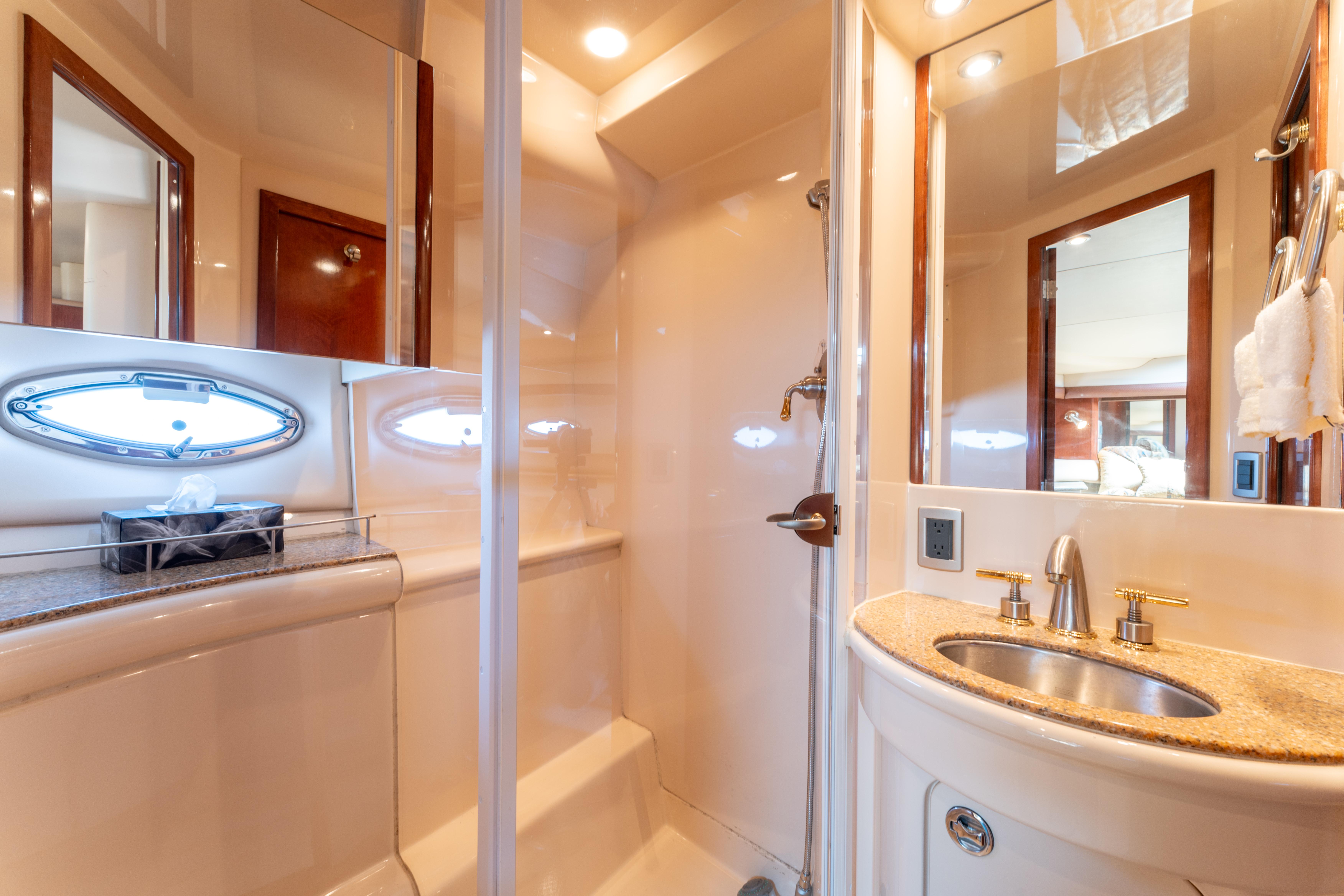 Luxurious bathroom in 2008 Meridian 459 Motoryacht with modern fixtures and elegant design.