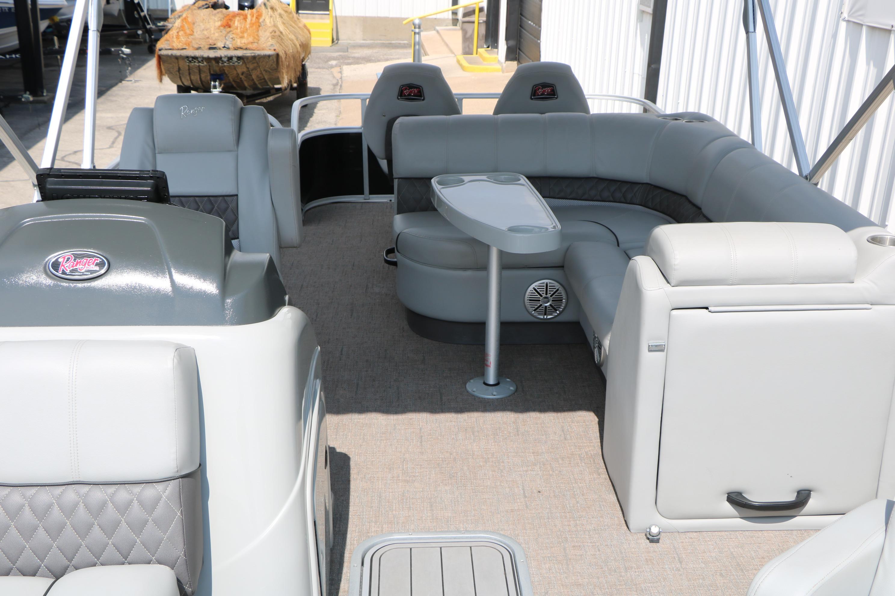 2021 Ranger 223FC pontoon boat interior with gray seating and table.