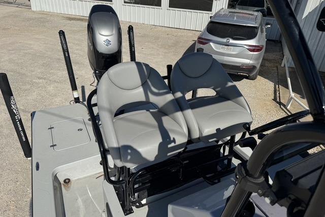 2025 Majek 24 Reaper boat with dual seats and Suzuki outboard motor.