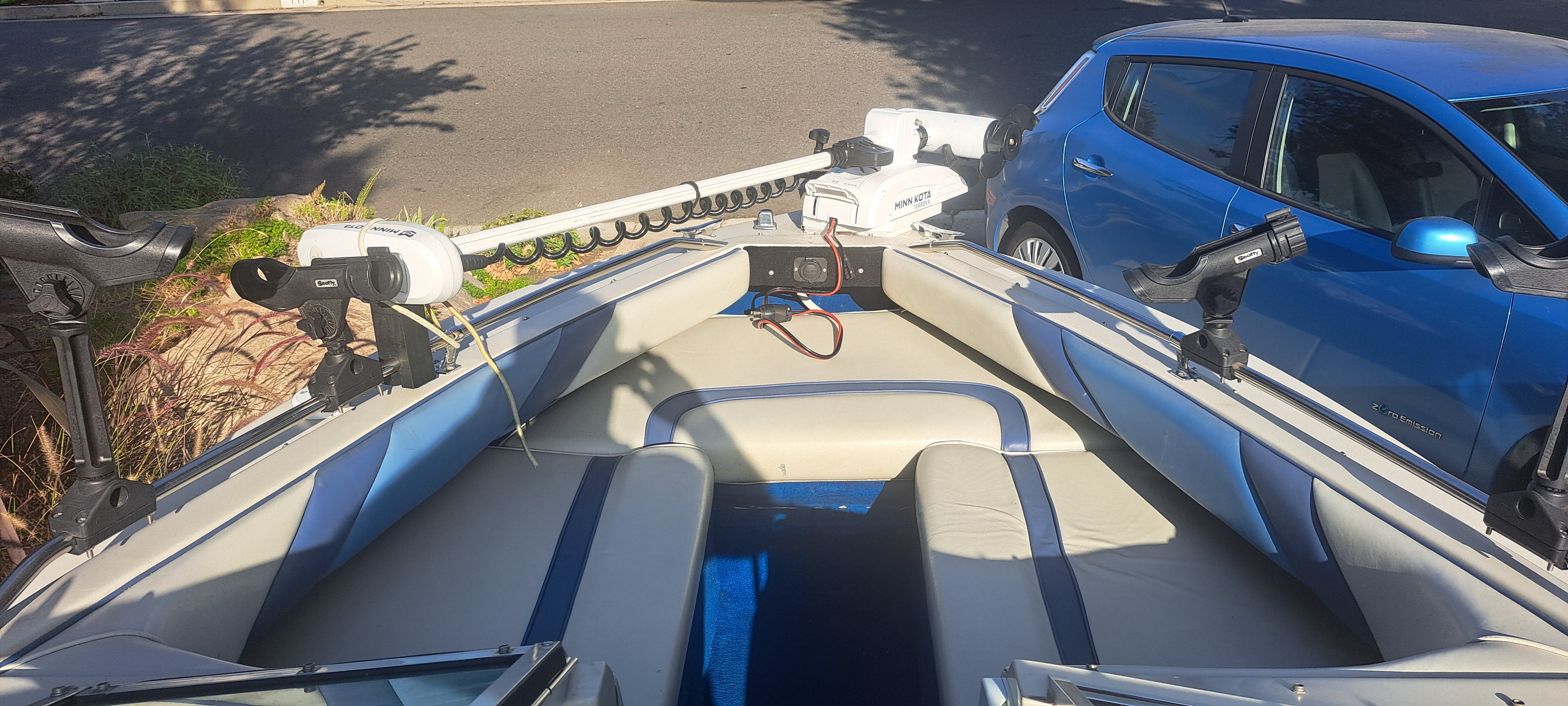 Interior view of a 1988 Sea Ray Seville boat with fishing rod holders.