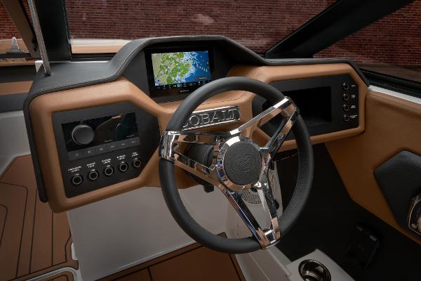 2025 Cobalt CS23 boat dashboard with modern steering wheel and navigation display.