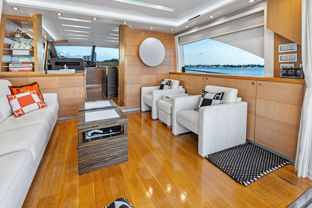 Luxurious interior of 2013 Astondoa 72 GLX yacht with modern furnishings and scenic window view.