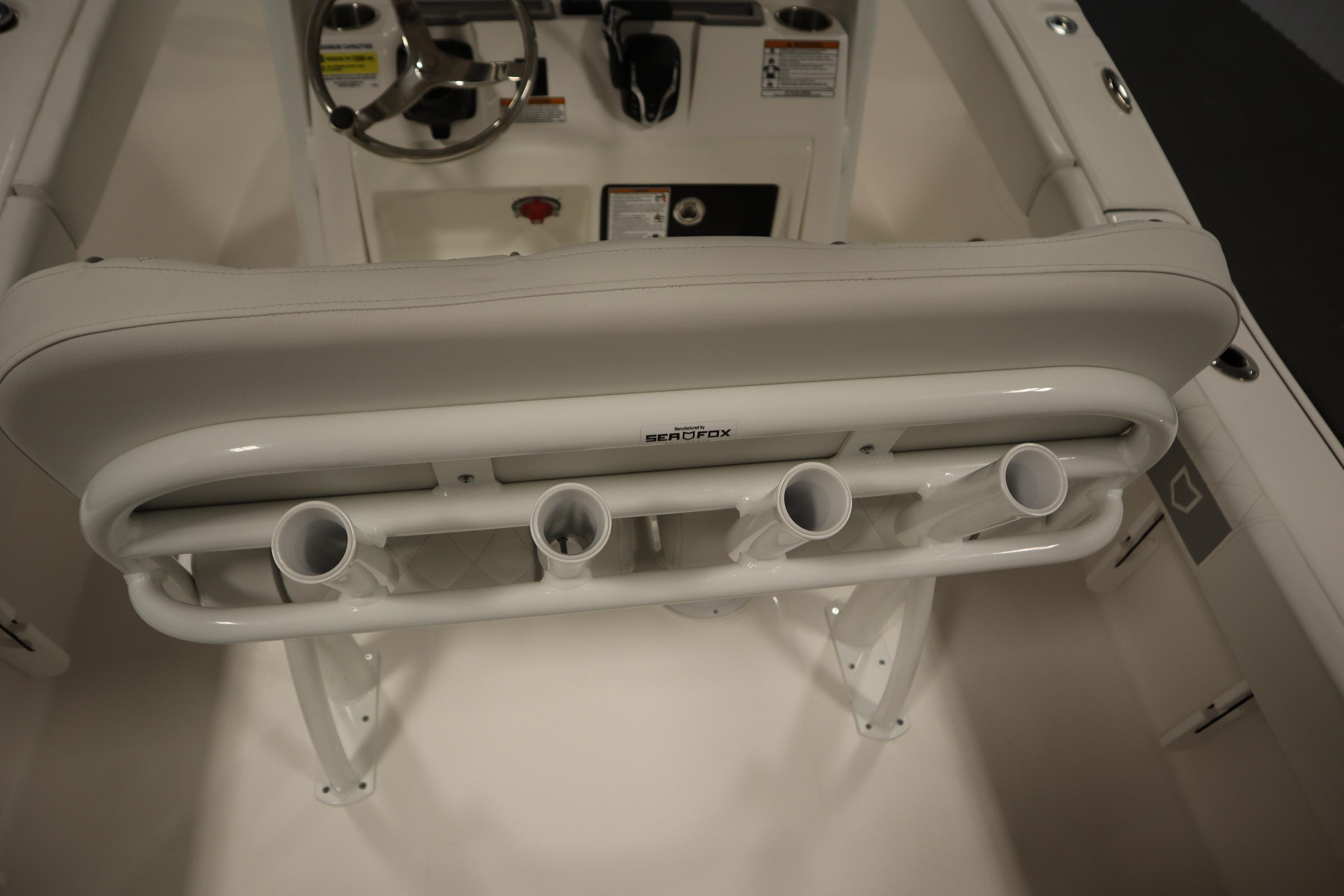 2026 Sea Fox 228 Commander boat interior with rod holders and steering console.