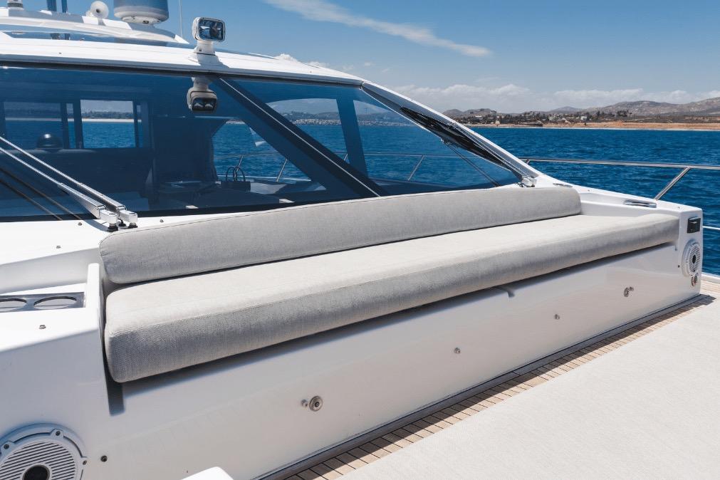 Luxury Azimut 60 yacht deck with cushioned seating, 2020 model, on open water.