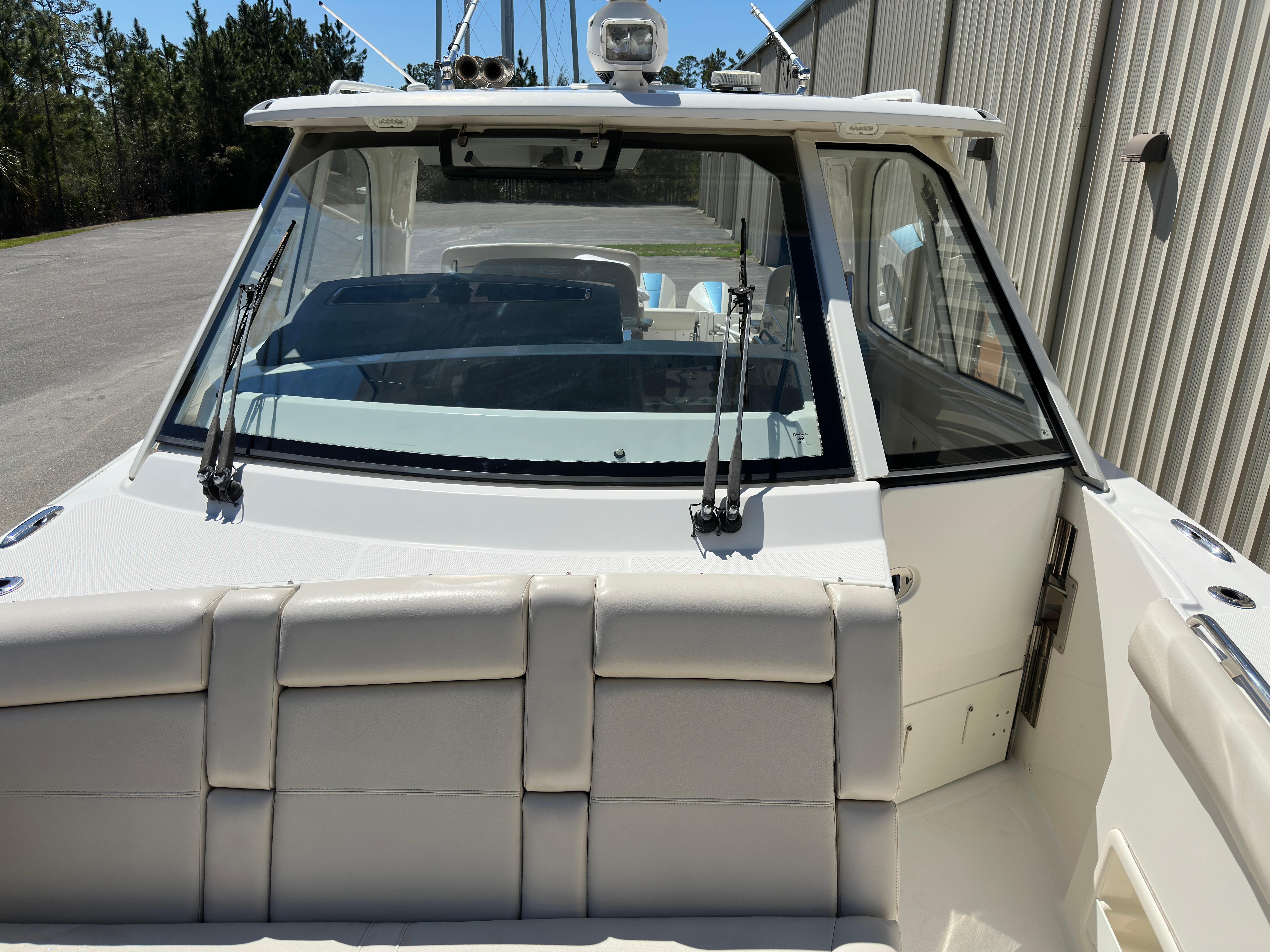 2021 Boston Whaler Realm 380 boat, rear view, showcasing seating and windshield.