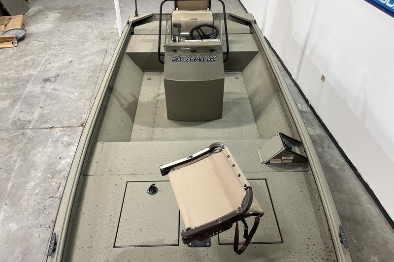 2025 SeaArk Shadow 18T boat interior with steering console and seating.