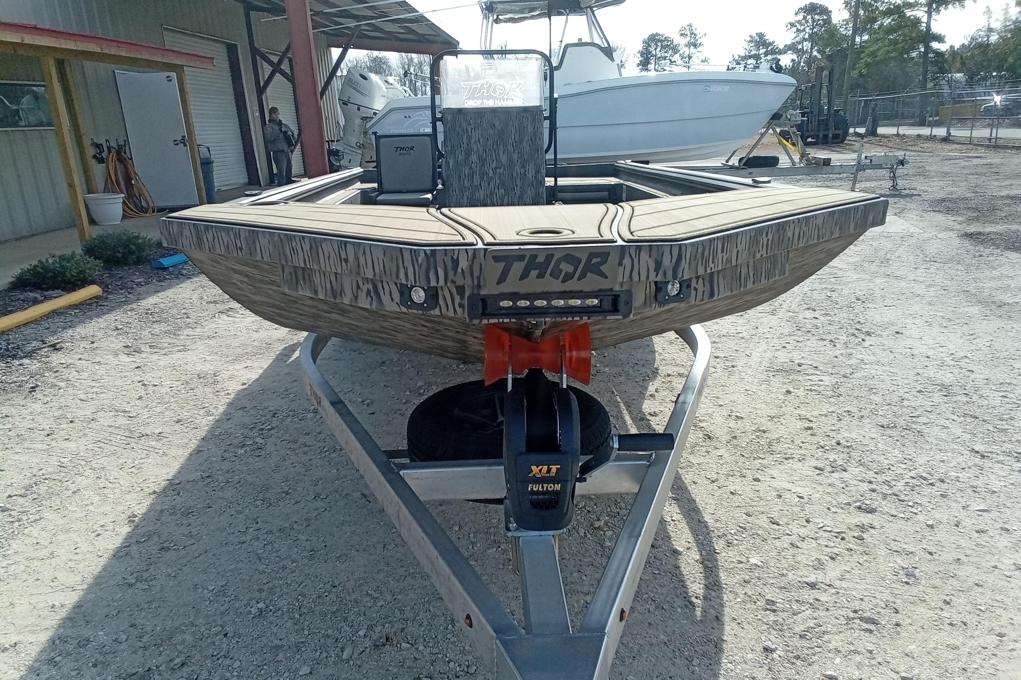 2026 Thor 1900 Low Country Elite boat on trailer, outdoor setting.