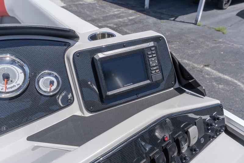 Dashboard of 2026 SunCatcher Select 322SL boat with Garmin display and gauges.