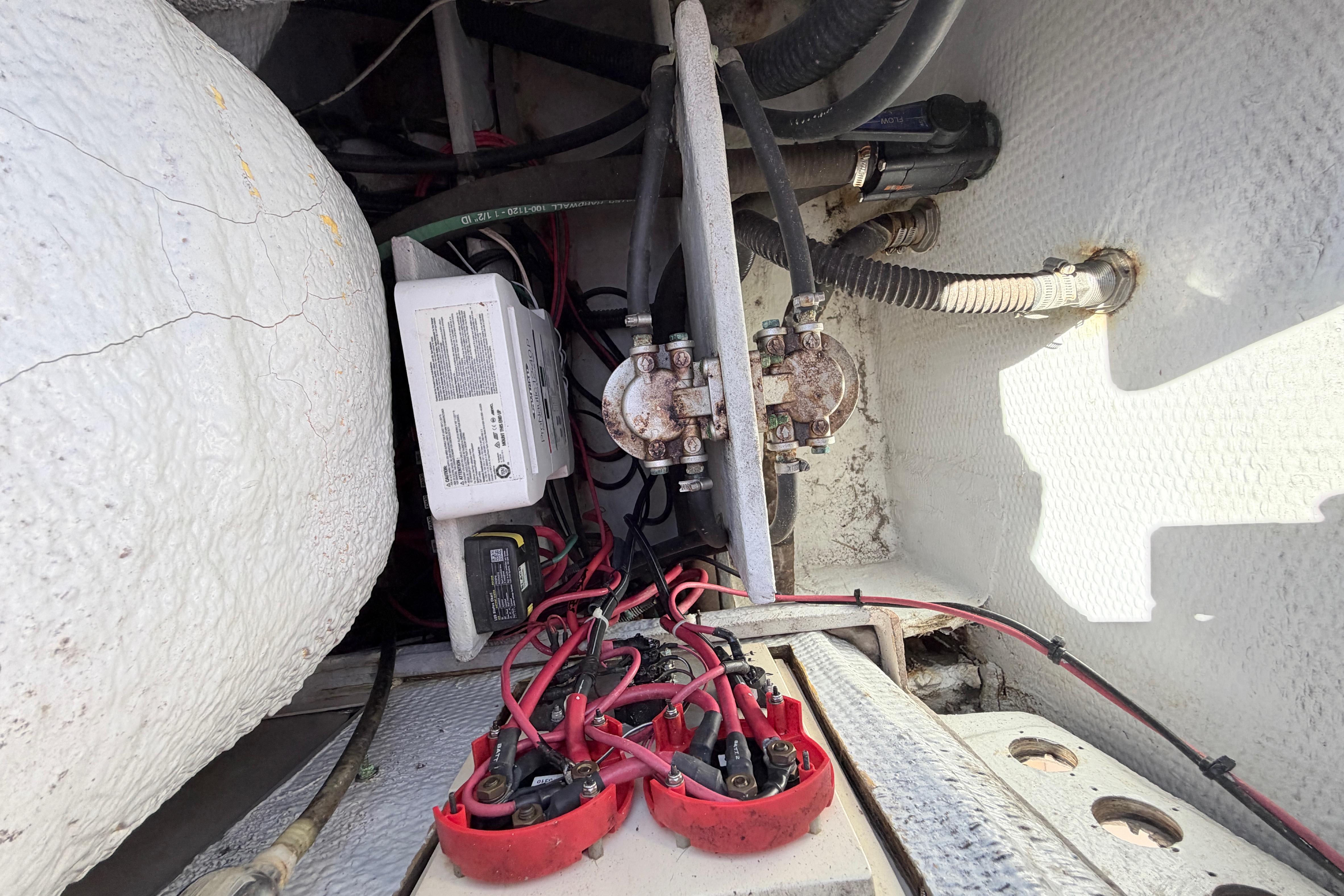 2006 Grady-White Sailfish 282 boat wiring and battery compartment with cables and connections.