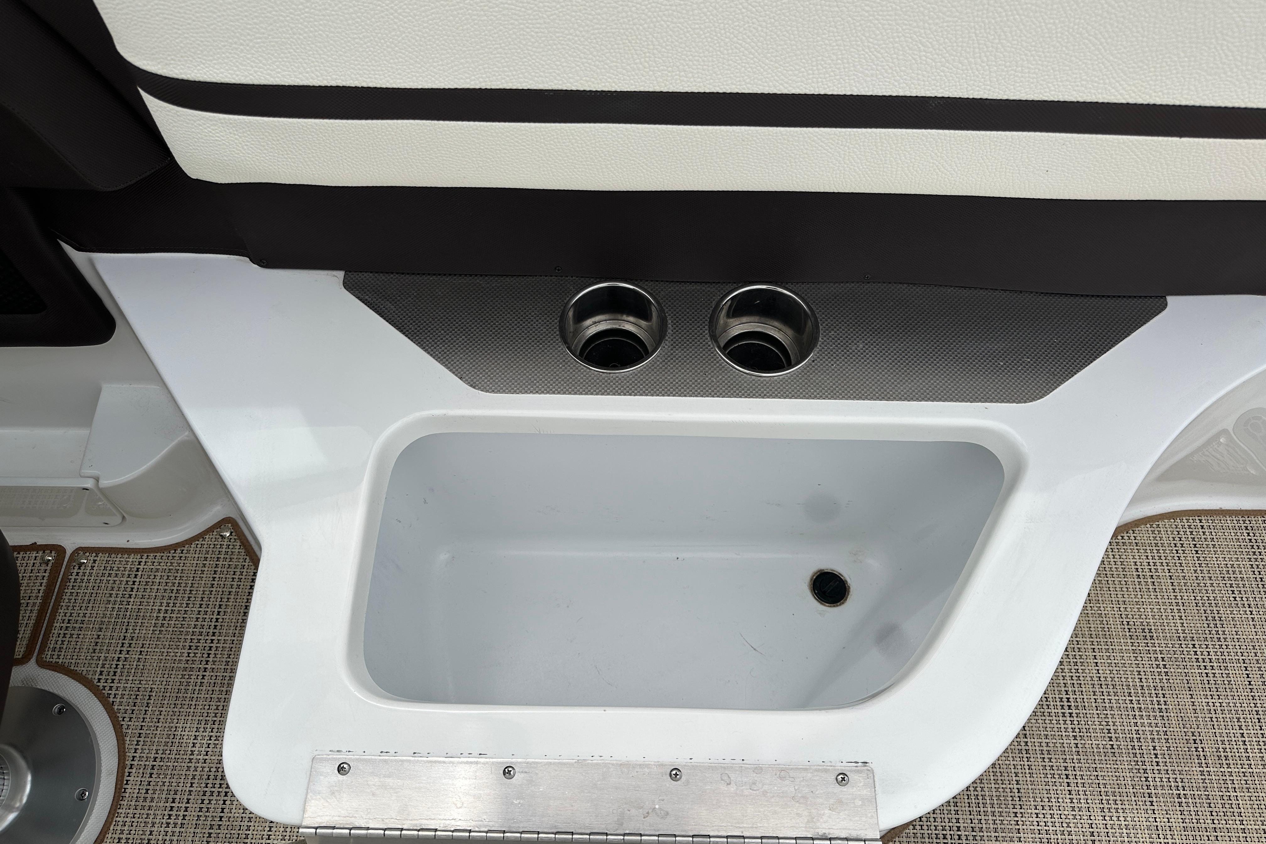 2019 Cobalt R5 boat interior with built-in cup holders and storage compartment.