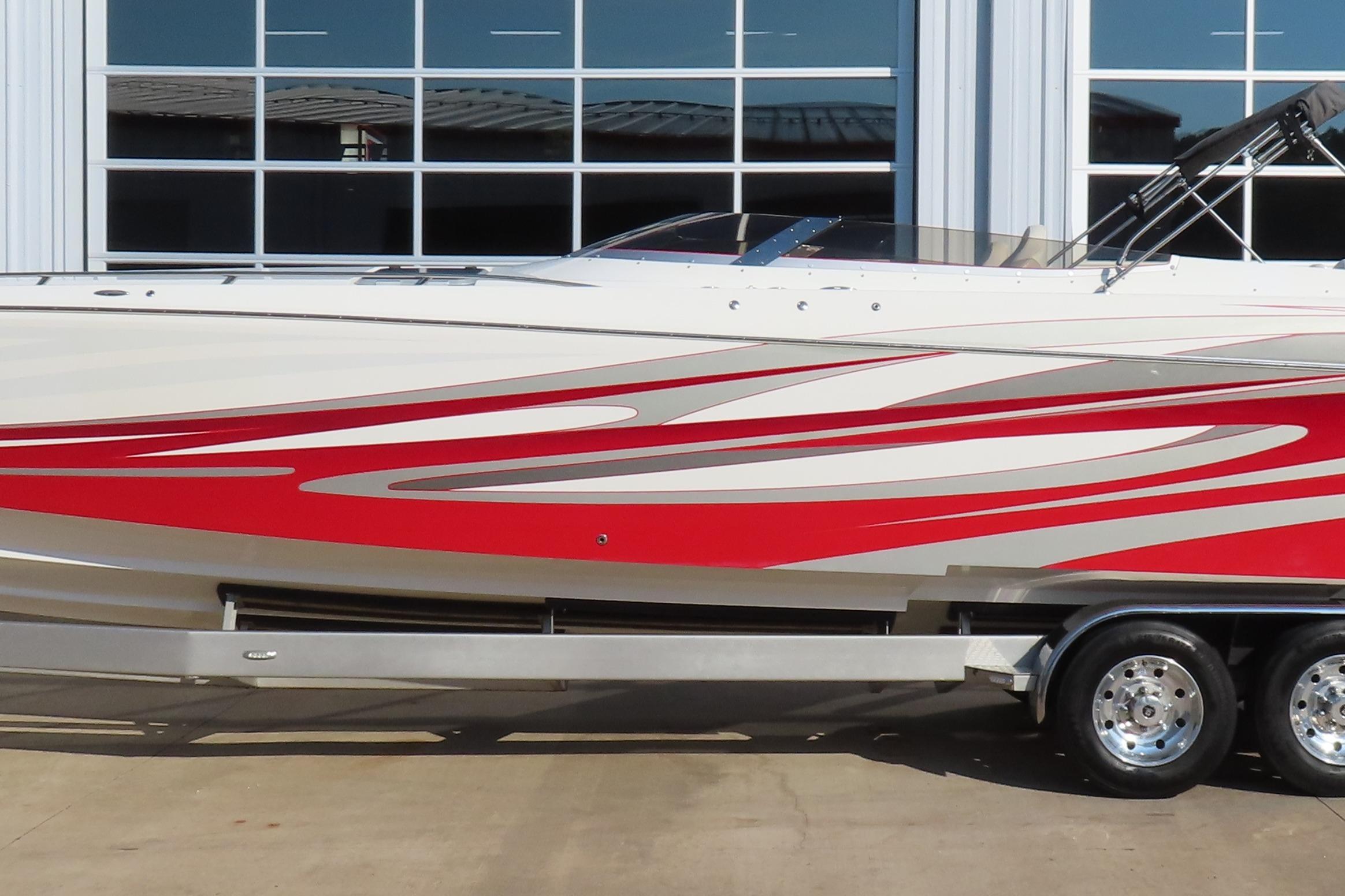 2013 Nordic 39 Poker Run boat with red and white design on trailer.