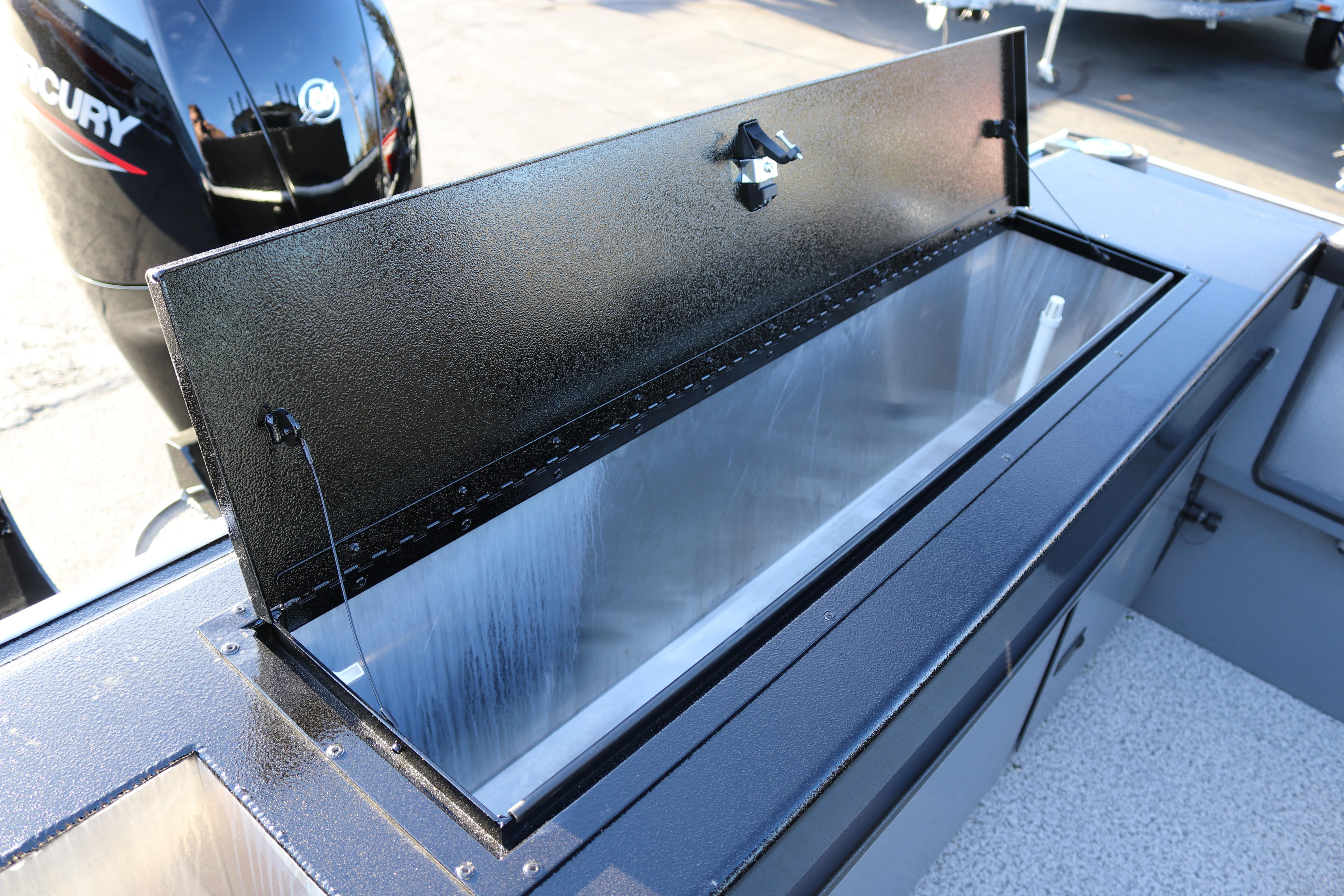 2026 Alumaweld Stryker X202 boat with open storage compartment and Mercury engine.