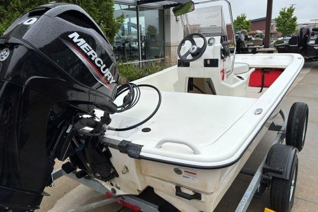 2025 Mako Pro Skiff 13 CC boat with Mercury engine on trailer.