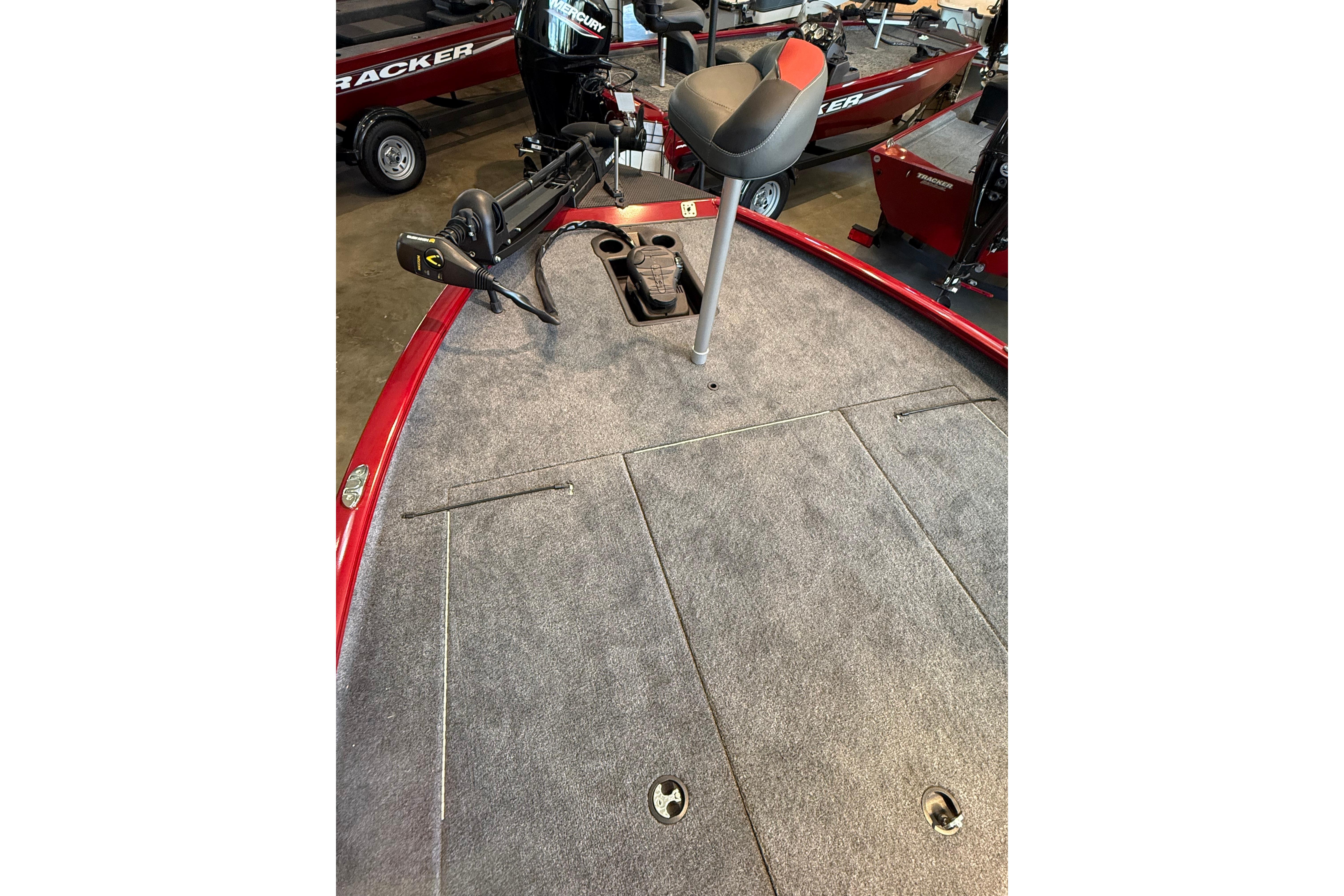 2025 Tracker Savage 215 boat deck with seat and trolling motor.