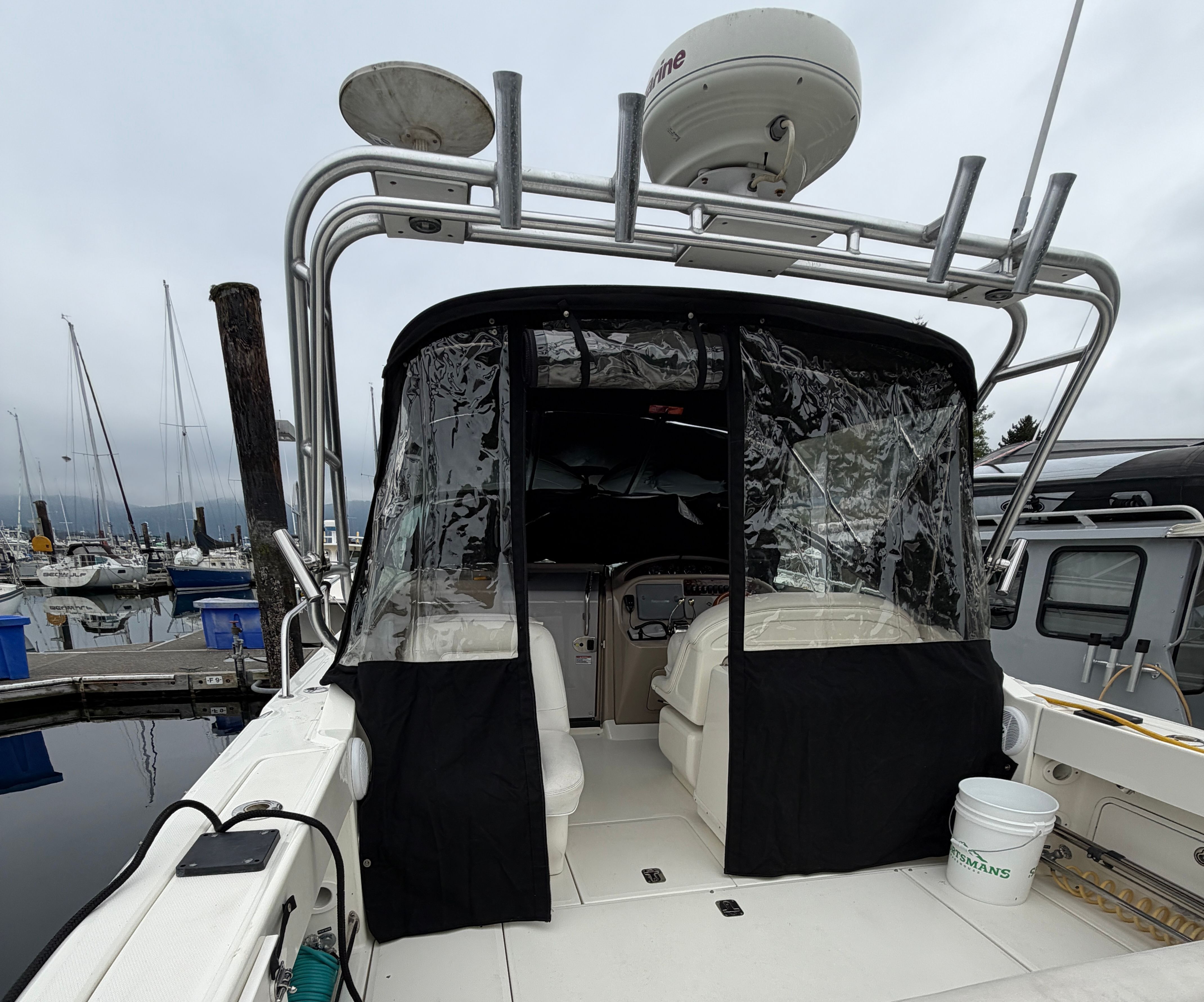 2005 Sea Ray 290 Amberjack at dock with cover.